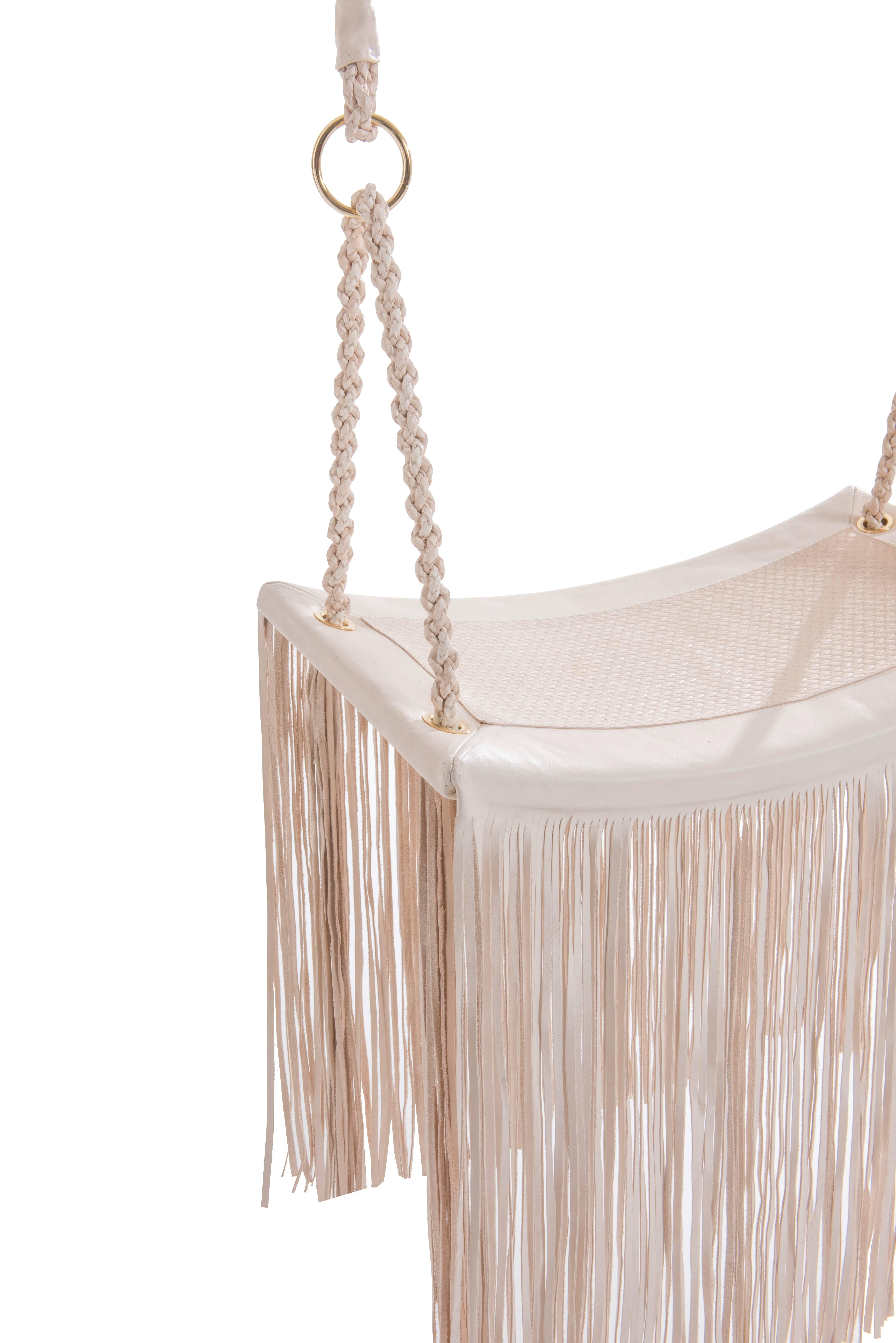 The project is initiated from leather yarns, and with it we value the handmade work of various craft techniques such as braid, cord, chain and fringe.
The swing chains were represented in three-dimensional shape with leather braids with inner steel