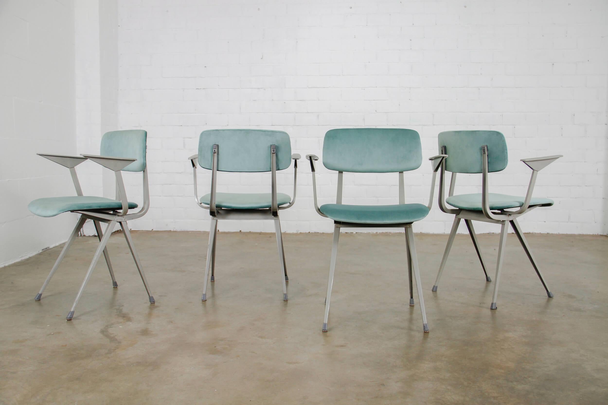 Revolt chair designed by Friso Kramer. 
The chairs have a new velvet upholstery and a grey metal frame.