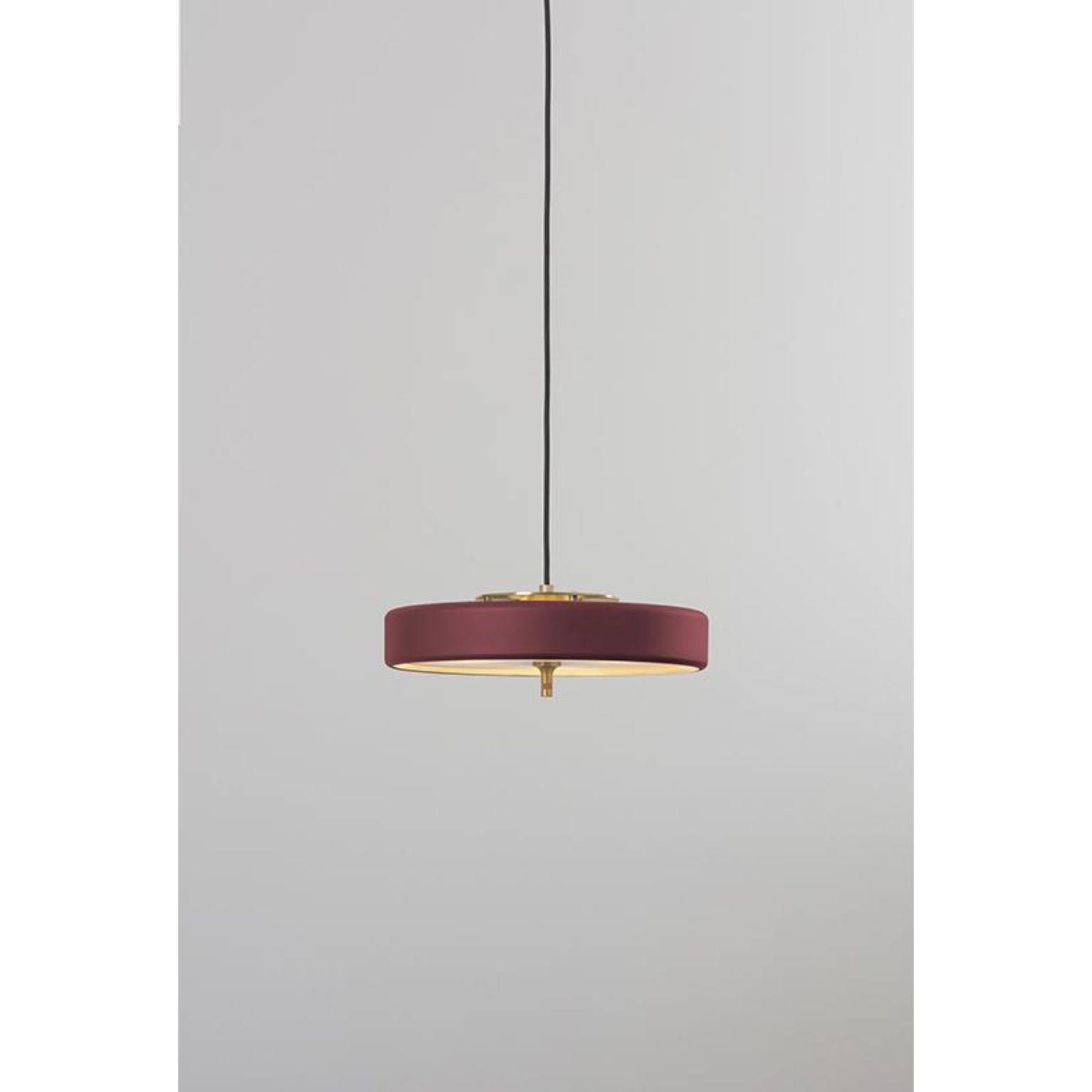 Revolve pendant light - Brushed brass - Oxblood by Bert Frank
Dimensions: 60-200 x 35 x 11 cm
Materials: Brass, steel

Also available in polished brass.

When Adam Yeats and Robbie Llewellyn founded Bert Frank in 2013 it was a meeting of minds and