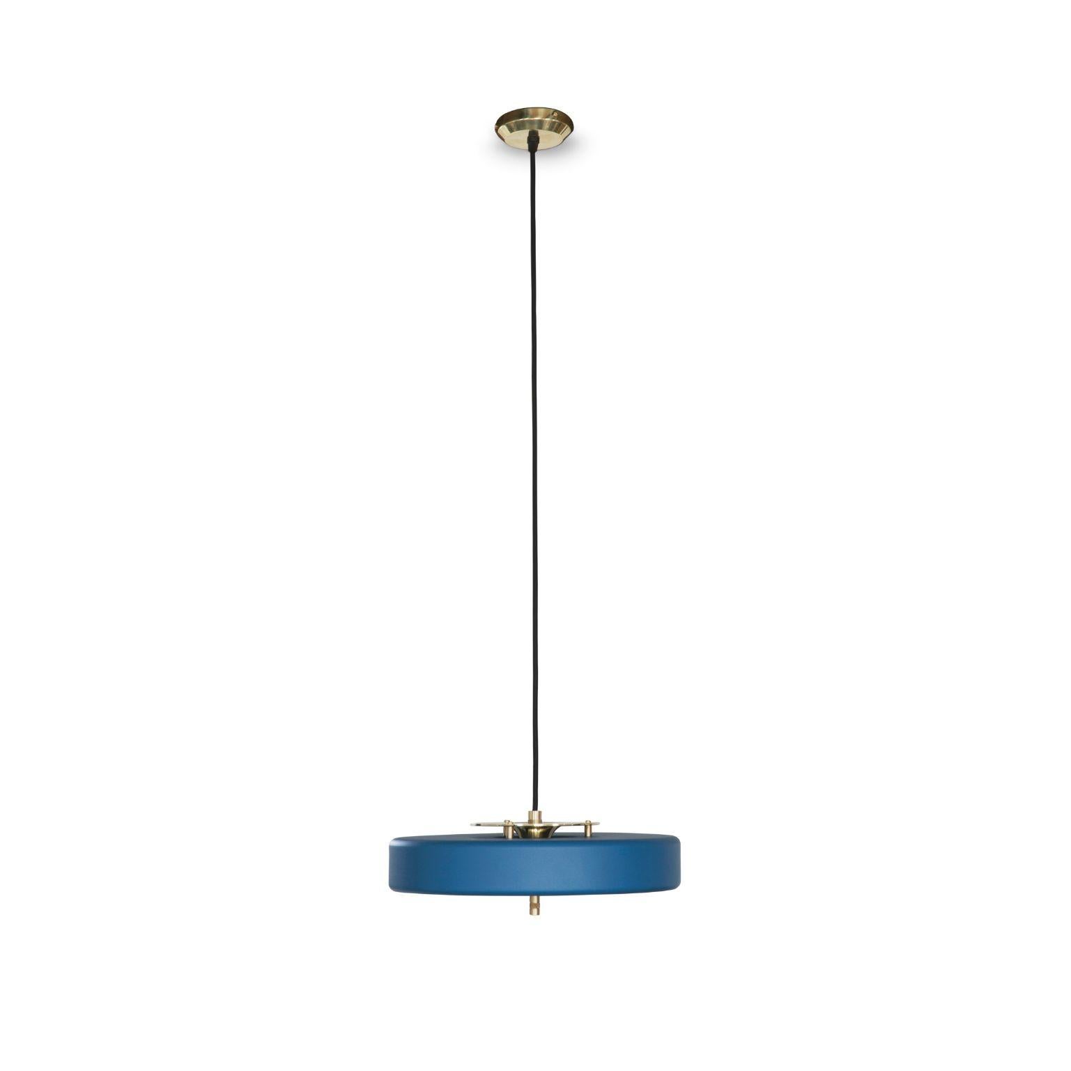 Revolve pendant light - Polished brass - Blue by Bert Frank
Dimensions: 60-200 x 35 x 11 cm
Materials: Brass, steel

Also available in brushed brass

When Adam Yeats and Robbie Llewellyn founded Bert Frank in 2013 it was a meeting of minds and the