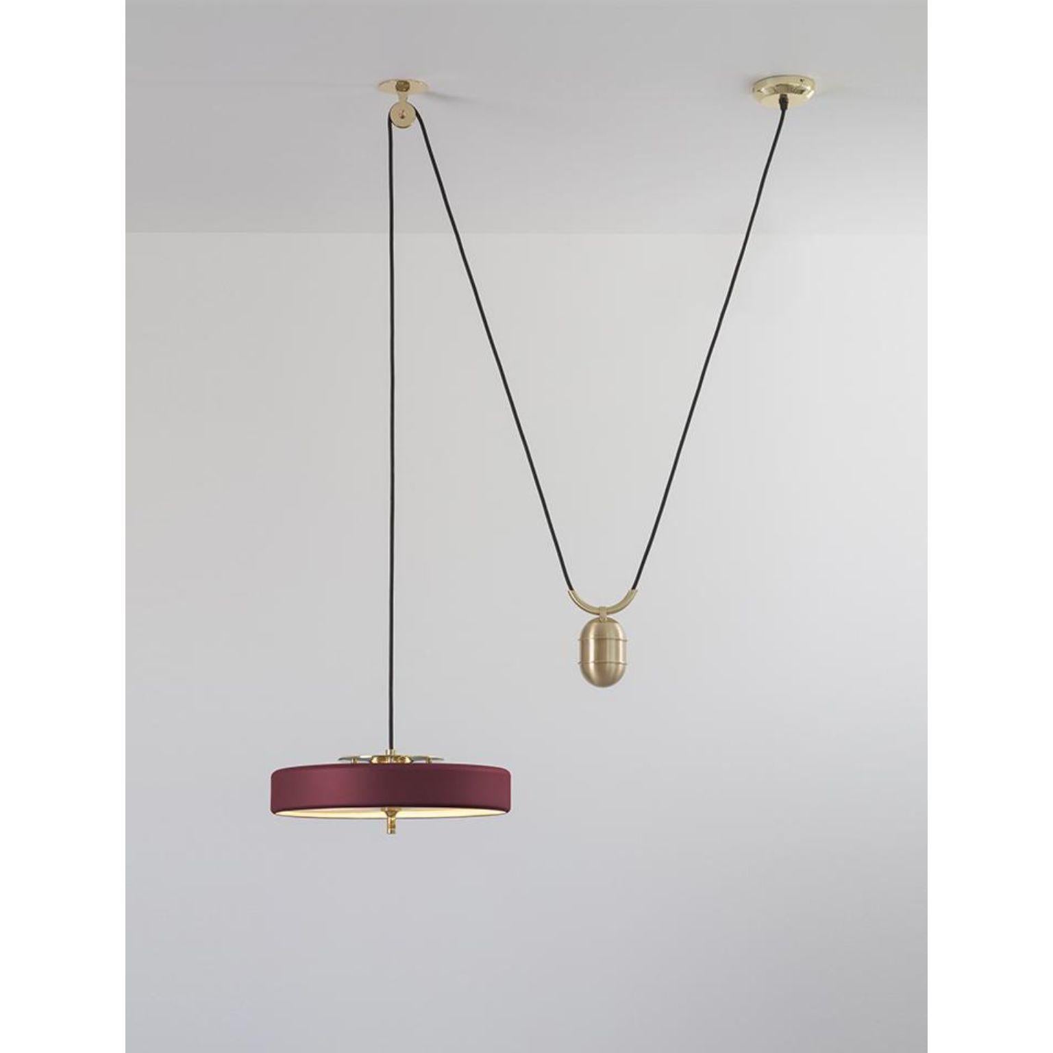Revolve rise and fall pendant light - brushed brass - oxblood by Bert Frank
Dimensions: 30 x 35 x 11 cm, small lamp: 7.6 cm
Materials: Brass, steel

Also Available in polished brass
When Adam Yeats and Robbie Llewellyn founded Bert Frank in