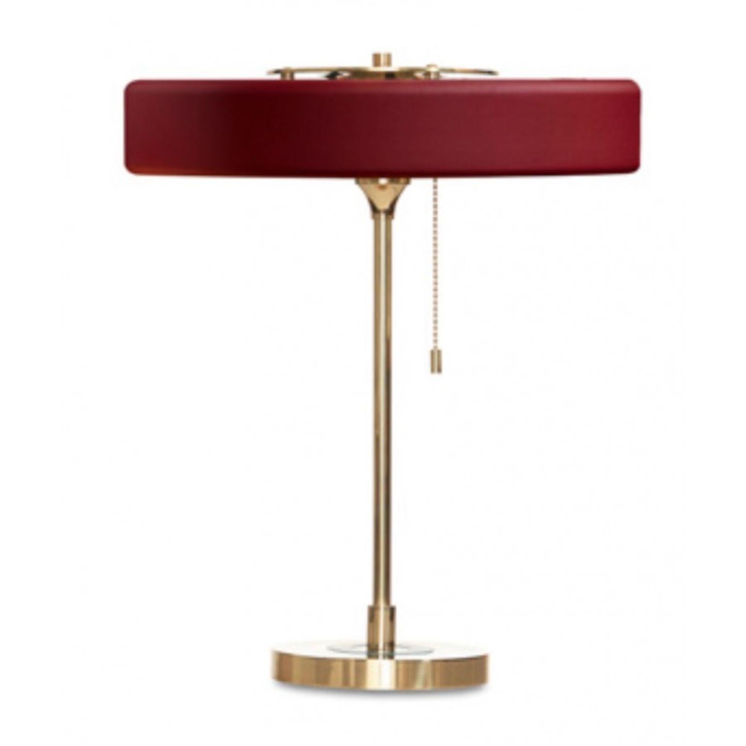 Revolve table lamp - Brushed brass - Oxblood by Bert Frank
Dimensions: 42 x 35 x 15 cm
Materials: Brass, steel

Also available in polished brass

When Adam Yeats and Robbie Llewellyn founded Bert Frank in 2013 it was a meeting of minds and the start