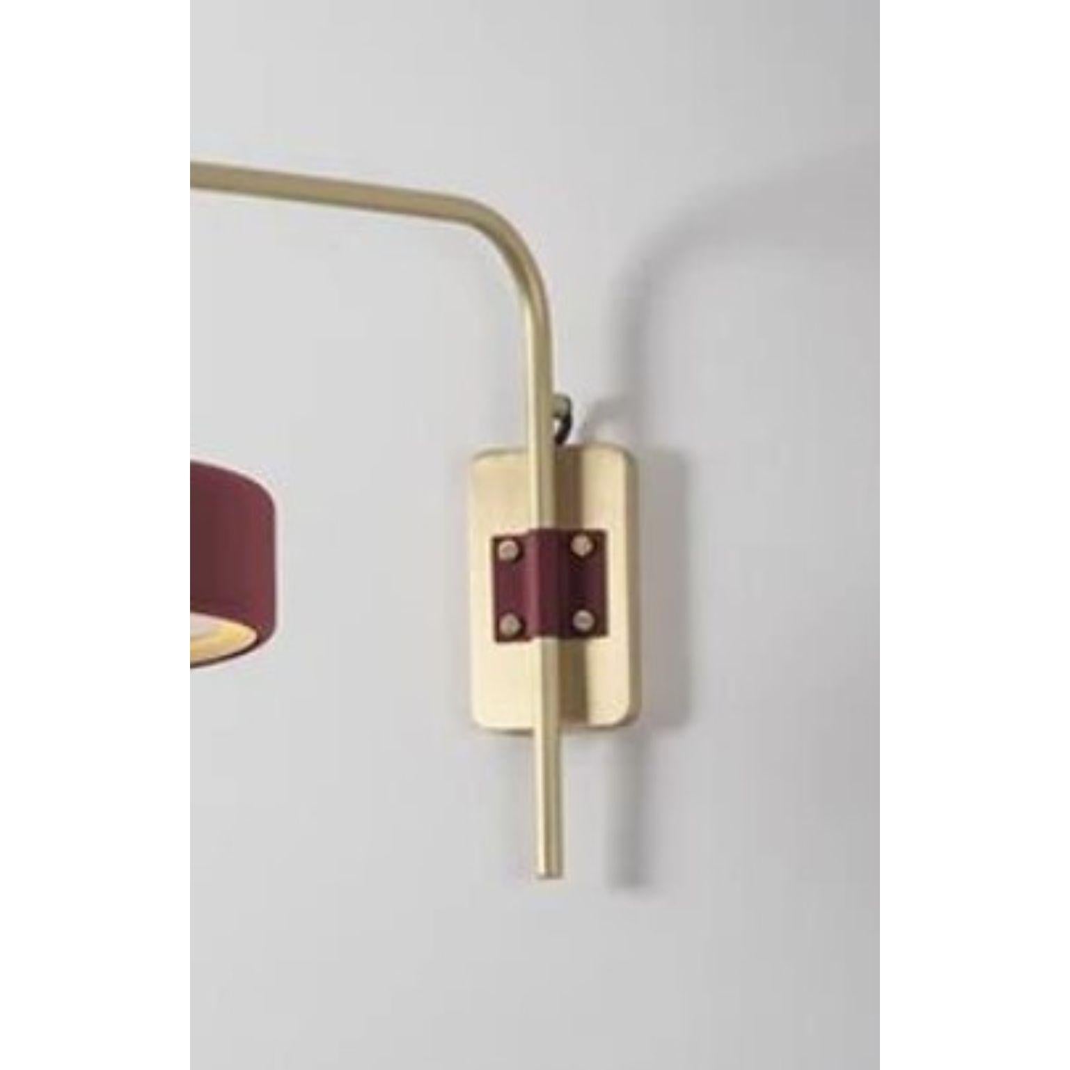 British Revolve Wall Light, Brushed Brass, Oxblood by Bert Frank For Sale
