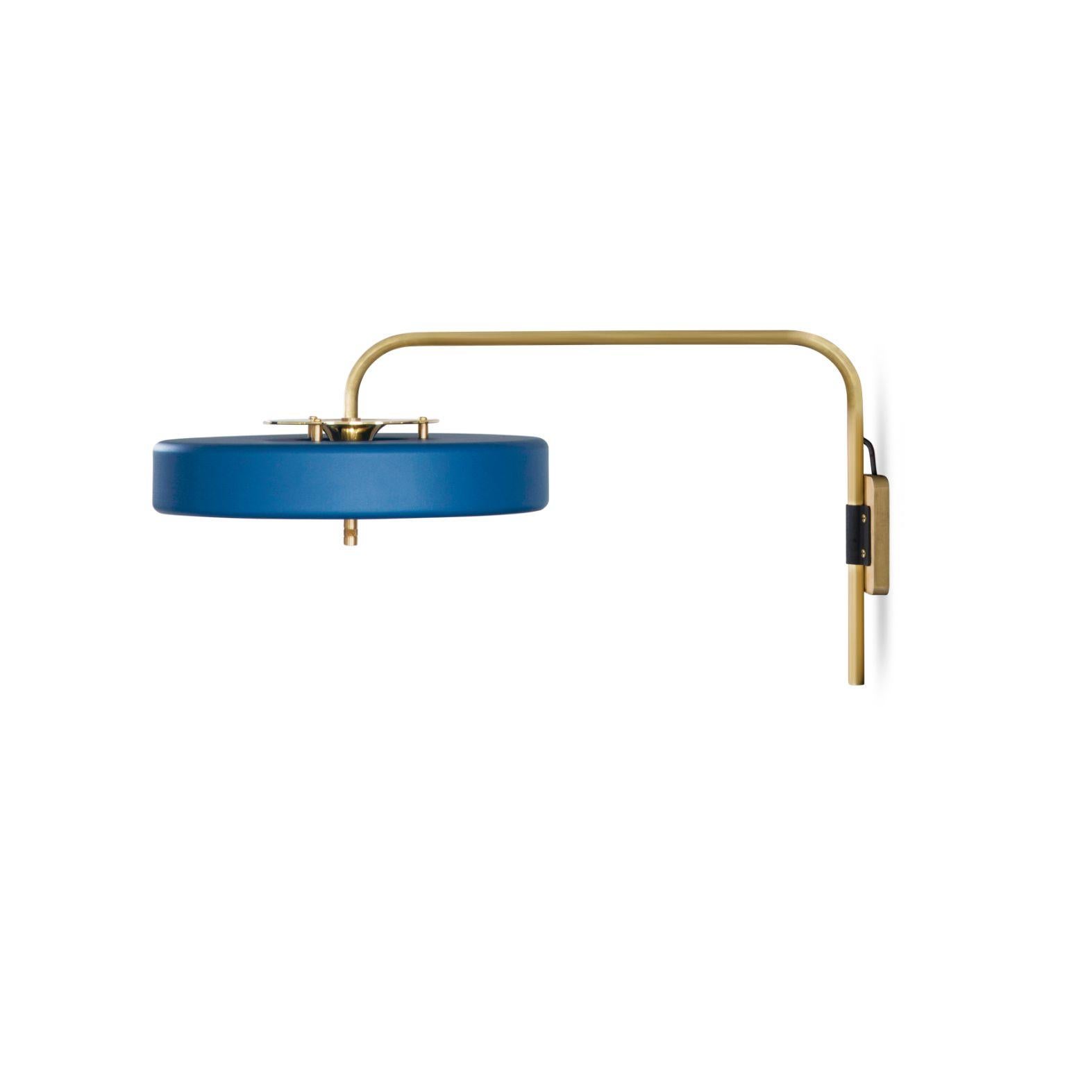 Revolve wall light - Polished brass - Blue by Bert Frank
Dimensions: 31 x 63 x 35 cm
Materials: Brass, Steel

Available in brushed brass

Flush-fitting opal glass shade with central dome of polished marble – white Carrara or green Guatemala –