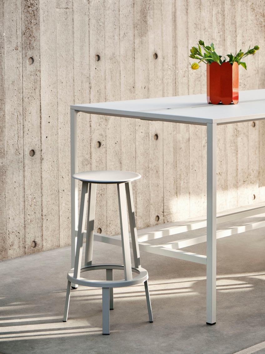 The Revolver bar stool is positioned on a bearing mechanism that enables the seat and footing to rotate 360 degrees. 
The slim, slightly dished seat features curved edges for additional comfort, while the footrest provides support and the weighty