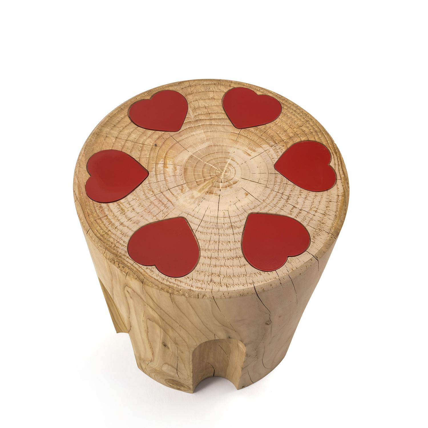 Stool Revolvheart in solid natural aromatic
cedar wood. Made in one block of cedar wood.
With red hearts in red lacquered iron.
Treated with natural pine extracts.
Solid cedar wood include movement, 
cracks and changes in wood conditions, 
this is
