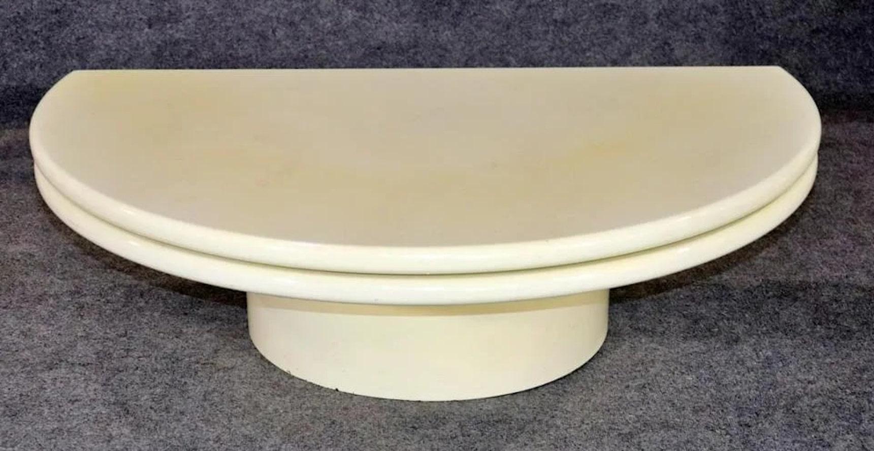 Mid-century modern round coffee table with a revolving top that closes to a half moon shape. Great for use as a lazy Susan at parties.
Please confirm location NY or NJ