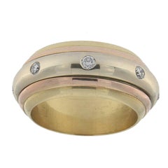 Revolving Ring in Three Colors Gold 18 Karat with White Diamonds