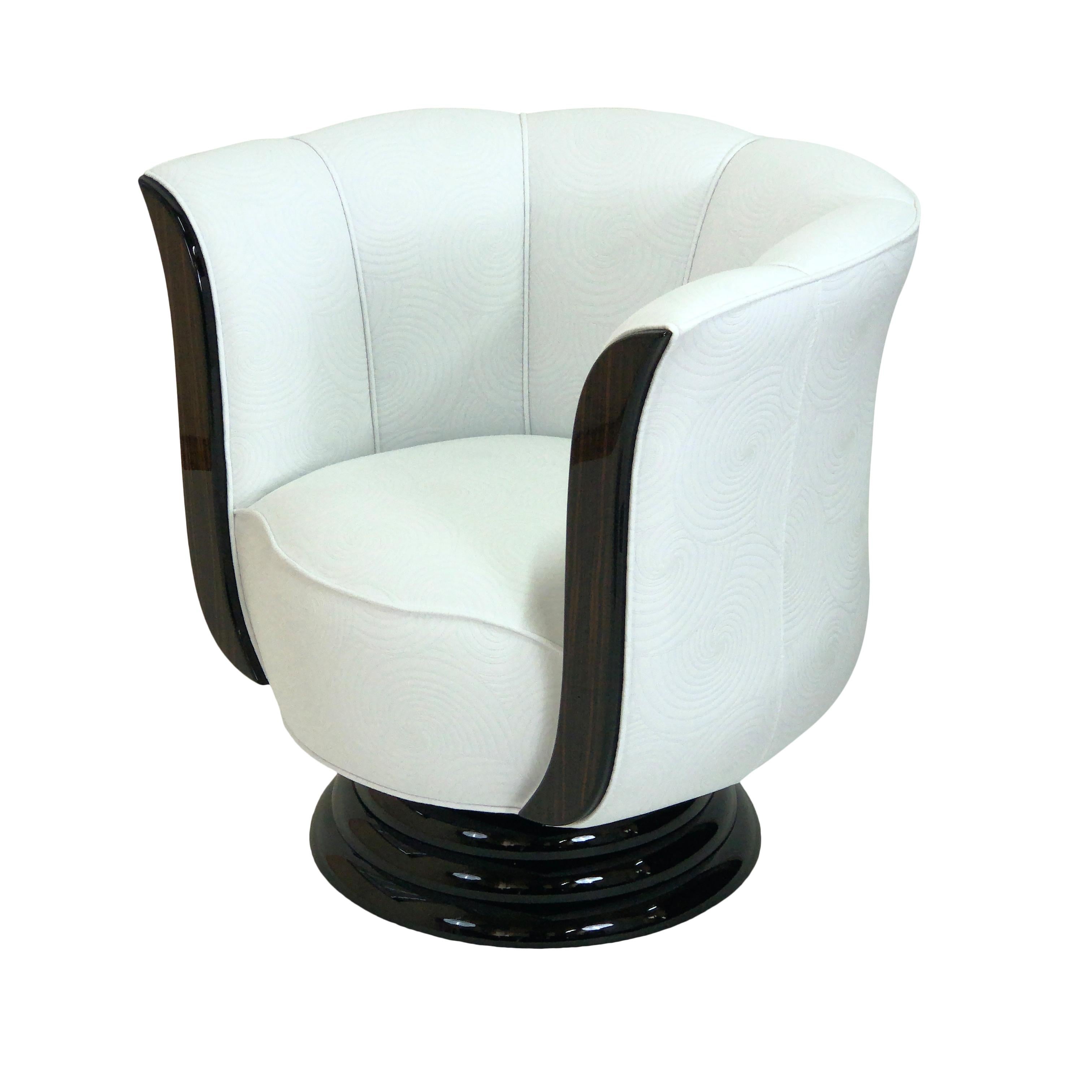 Typical tulip shaped Art Deco style club chair on a round, revolving base.
Excellent seating comfort with high quality upholstery.

Handmade in Germany. 

Lacquered wood.
Black lacquered base.
Upholstery with spiral pattern. 

Different