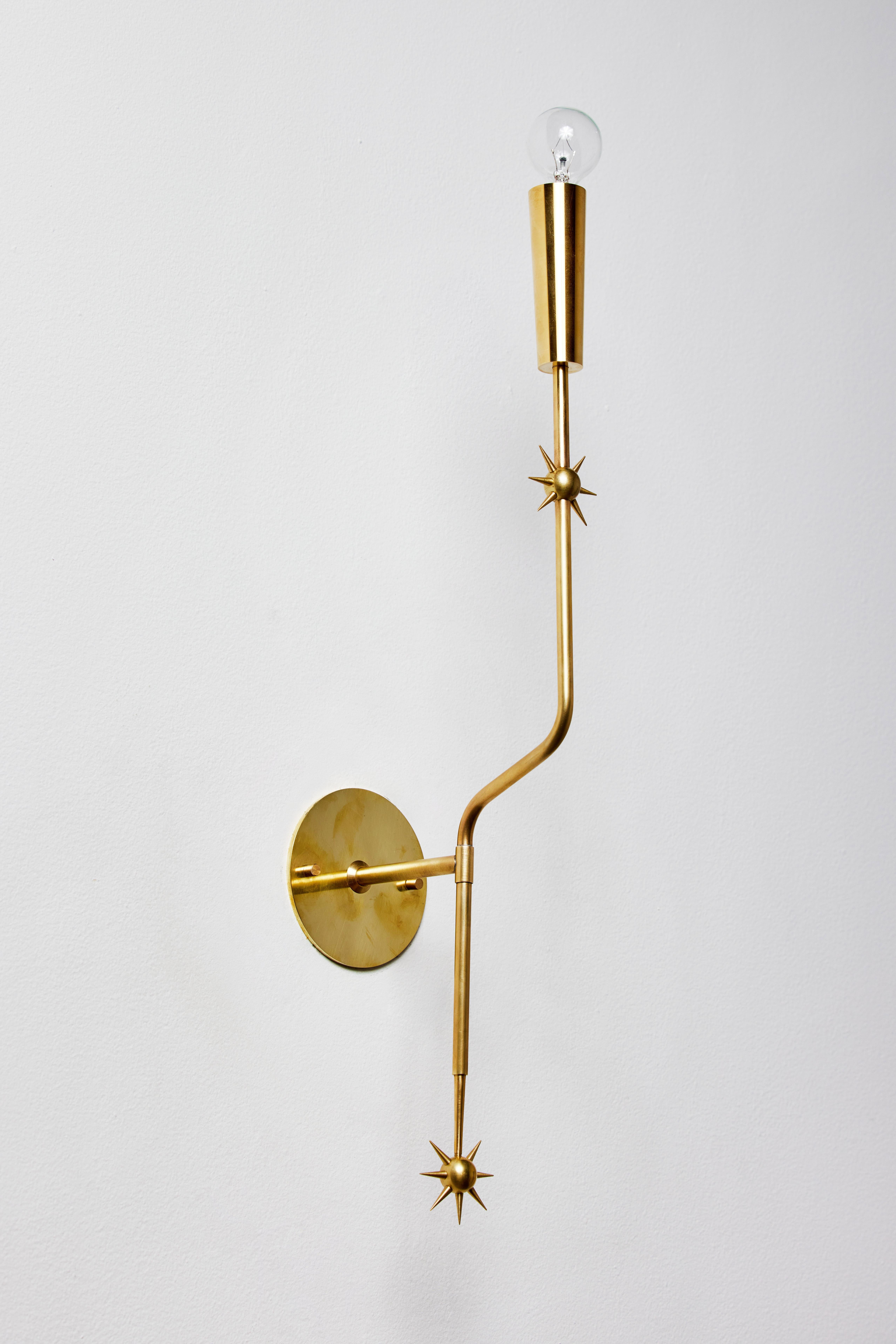 Rewire custom brass sconce in the style of Stilnovo. Current production custom fabricated in Los Angeles by rewire gallery. Brass, custom brass backplate. Takes one E12 candelabra 40-60w maximum bulb. Bulb provided as a one time courtesy.