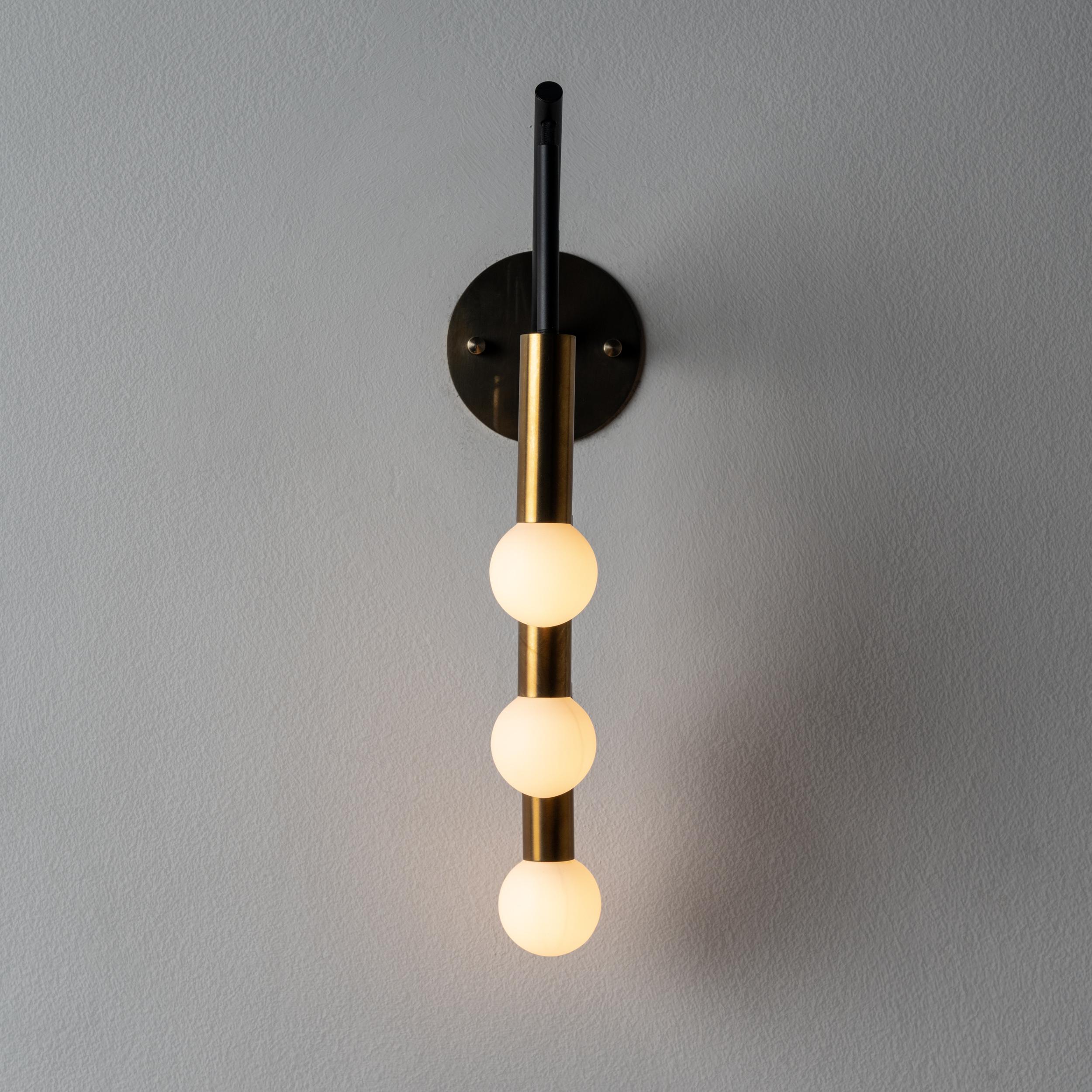 Rewire Custom Wall Light in the style of Interlampadario. Brass, metal. Manufactured in Los Angeles. We recommend. Lamping: 120v 3Qty E12 Candelabra Socket w/ 40w Frosted Bulb/ Lightbulbs not included. Priced and sold individually.