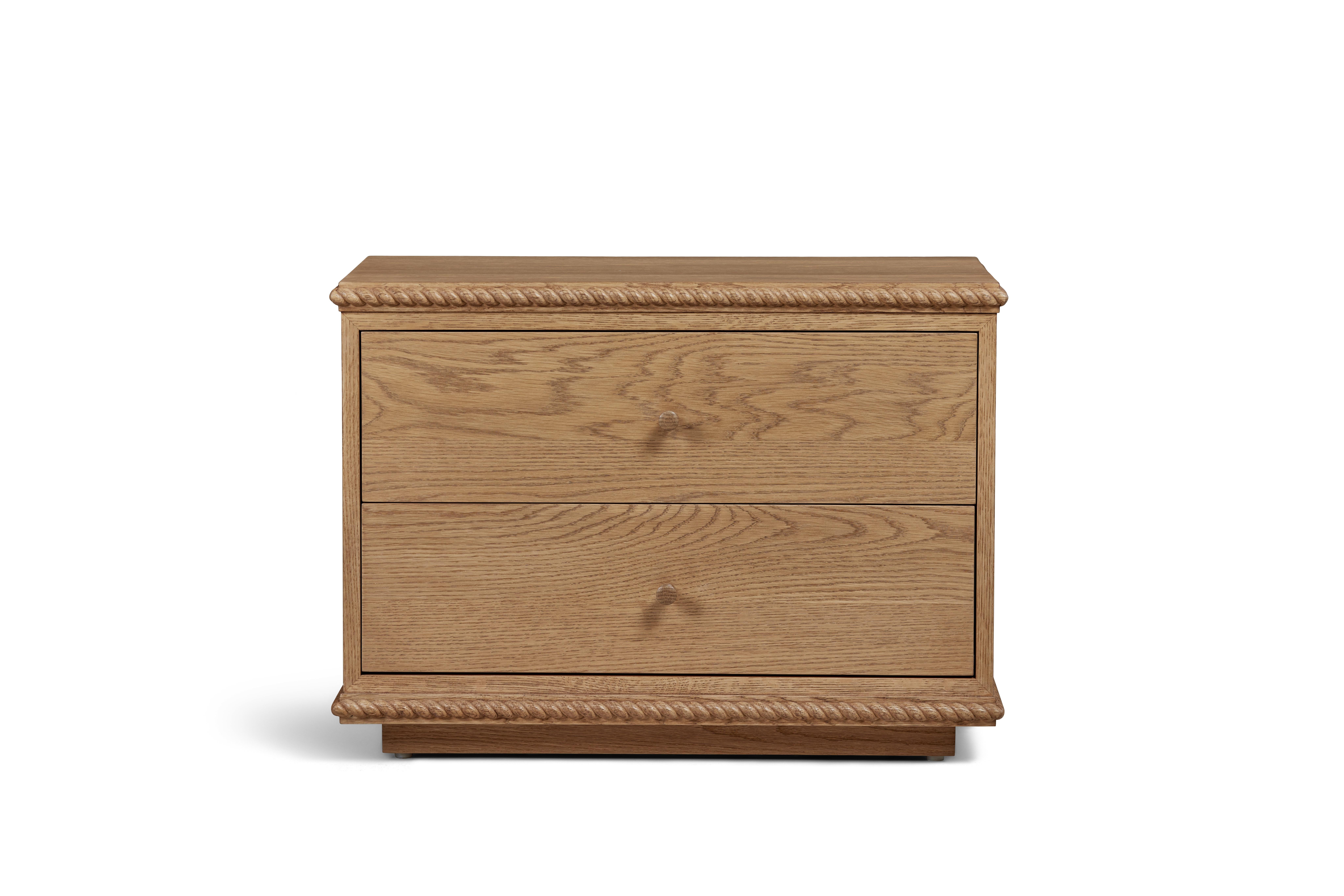 A low-profile nightstand or side table combining a classical twisted rope detail with clean-lined simplicity, featuring two drawers with dovetail joinery and soft-close glides. Inquire for customizations. 

Our Rey Collection conjures memories of a