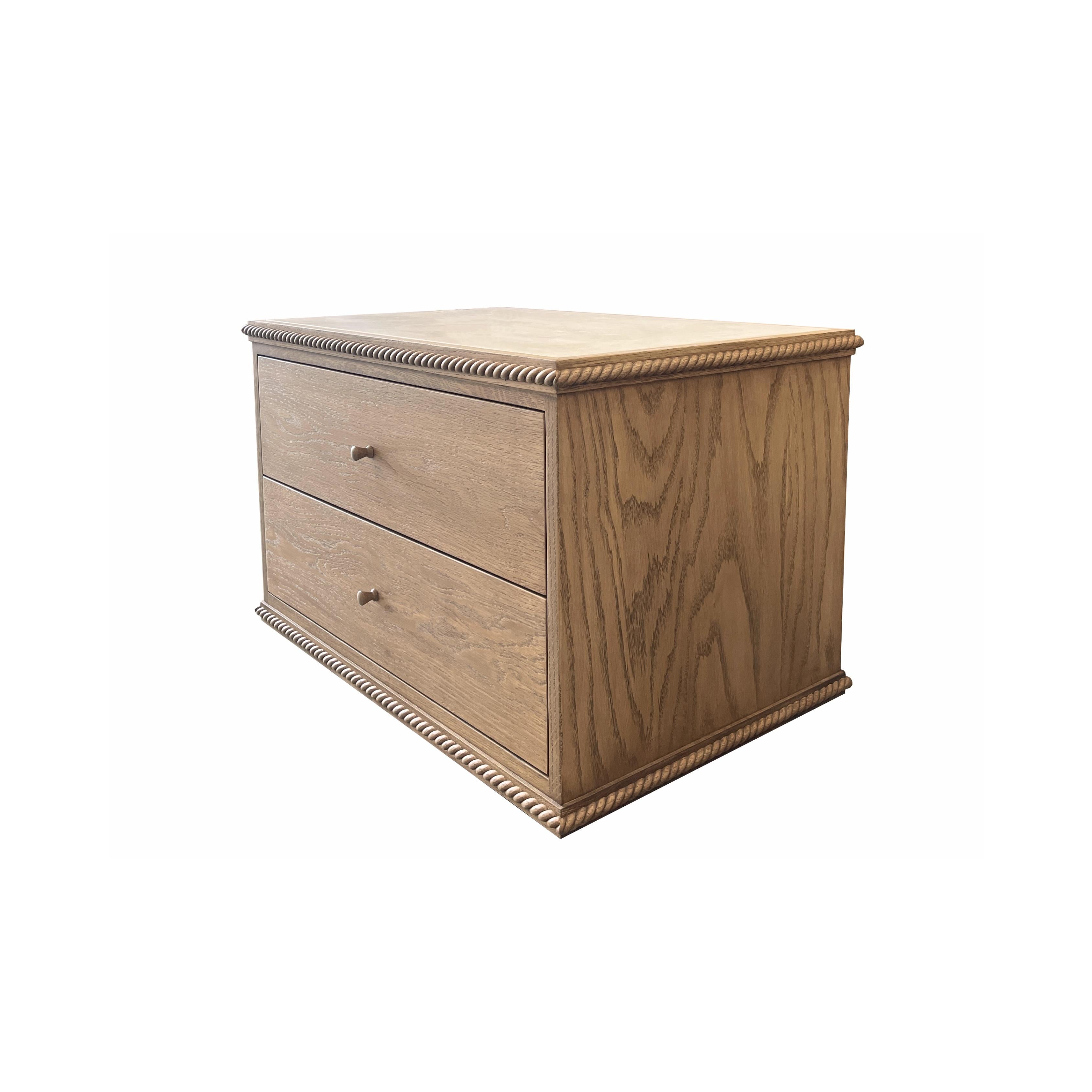 A low-profile nightstand or side table combining a classical twisted rope detail with clean-lined simplicity, featuring two drawers with dovetail joinery and soft-close glides. Inquire for customizations. 

Our Rey Collection conjures memories of a