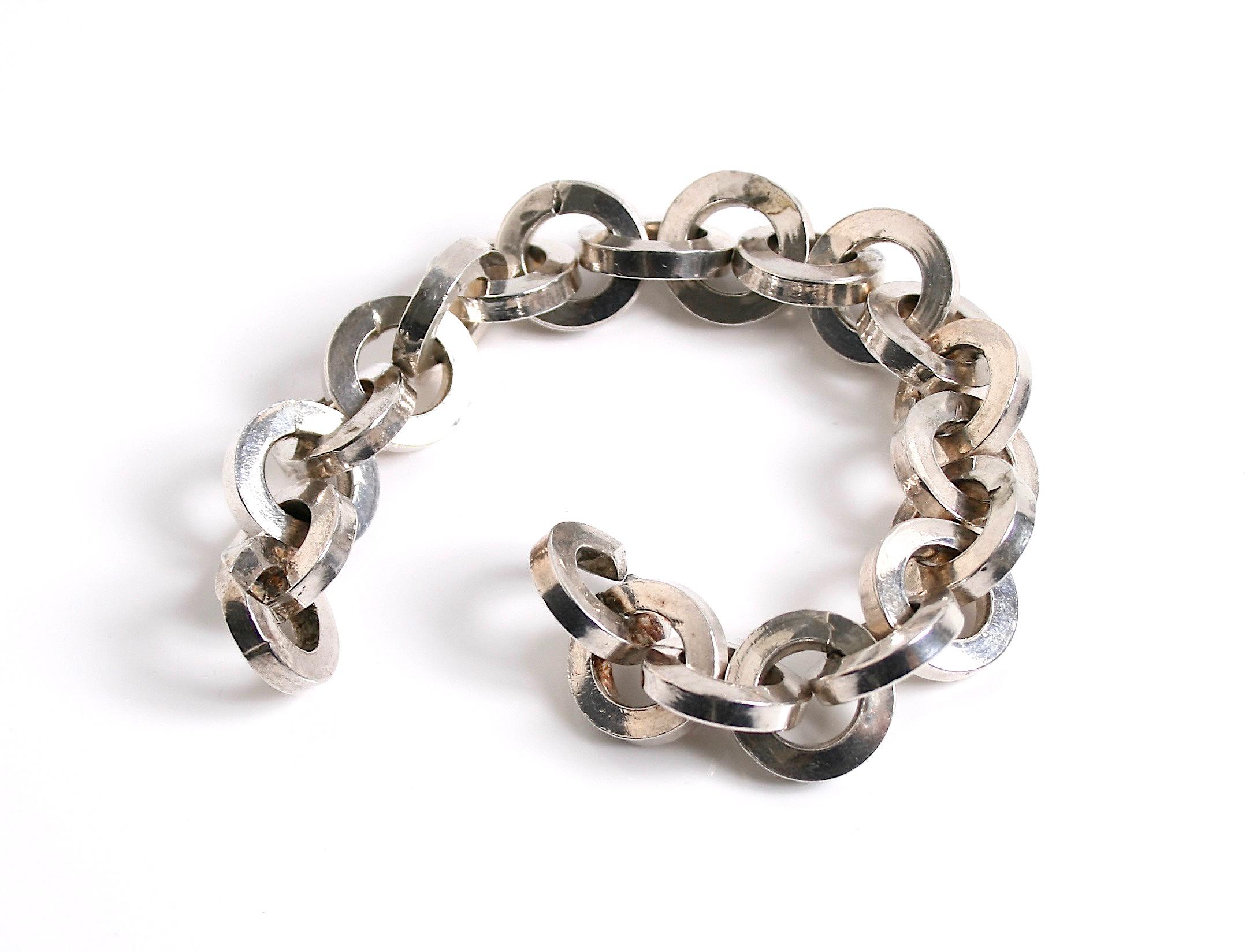 Heavy link sterling silver hand beaten chain bracelet designed by Rey Urban for Age Fausing Denmark c.1970 signed Rey Urban in script  Å Fausing Denmark

Rey Urban, born 1929-2015 in Stockholm he was a Swedish silversmith and designer.
He set up his