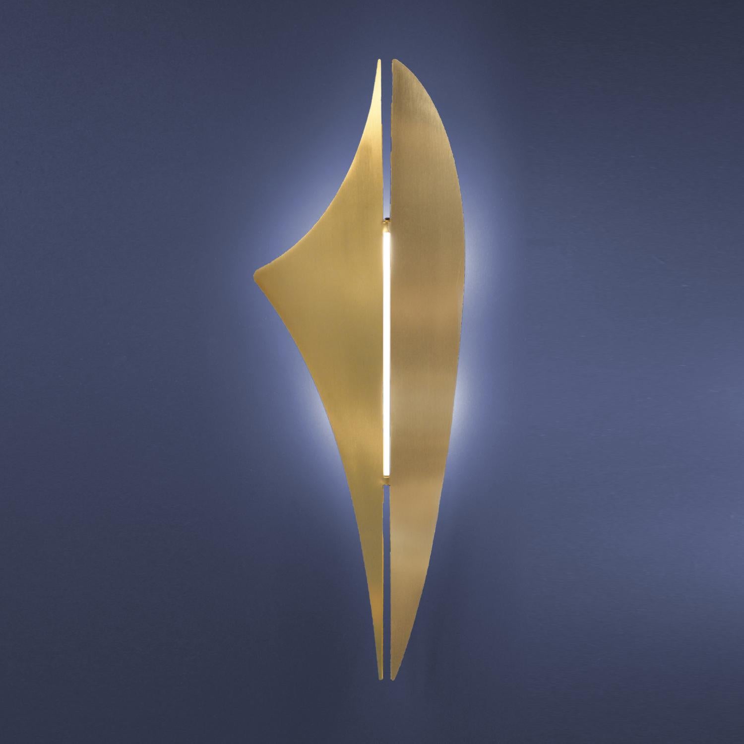 The REY wall light in brushed brass is a contemporary wall light that is designed to be as beautiful lit as it is unlit. 

The sculptural light works beautifully as a pair or either side of a mirror or wall. 

Available wired for the US.

Inspired