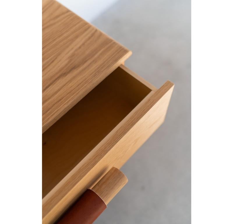 The Reyes Dresser is handmade locally in Los Angeles, California. The solid wood oak casing is bordered with soft, bullnose edges. All six drawers feature a handmade oak dowel pull, wrapped in natural vegetable tanned leather with soft-close drawer