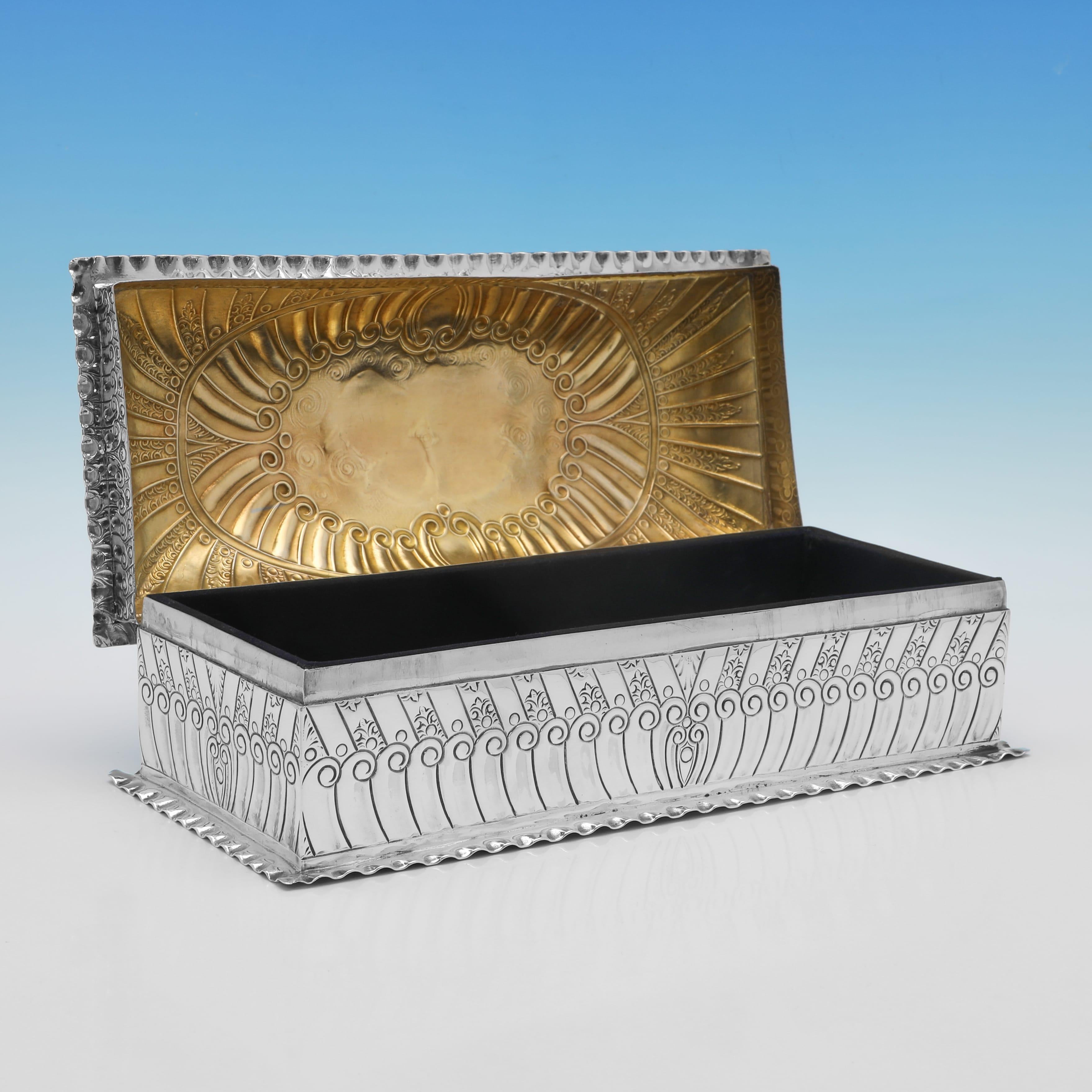 Hallmarked in London in 1889 by John Newton Mappin, this wonderful, Victorian, Antique Sterling Silver Jewellery Box, features swirled and sunken fluted decoration, and a representation of the 'Reynolds Angels' to the lid. The jewellery box measures
