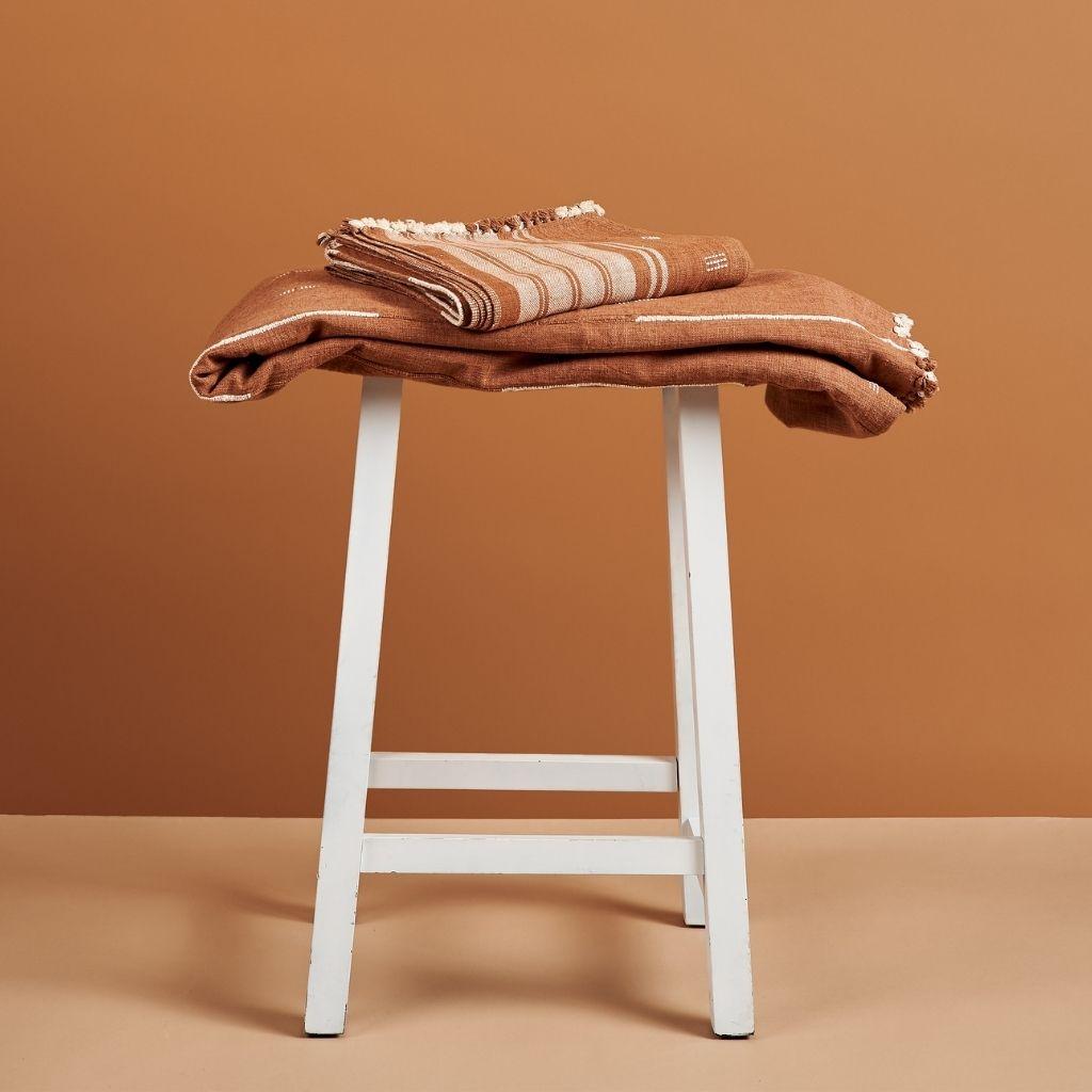 Custom design by Studio Variously, REYTI is a organic cotton throw / blanket handwoven by master weavers in India.

A sustainable design brand based out of Michigan, Studio Variously exclusively collaborates with artisan communities to restore and