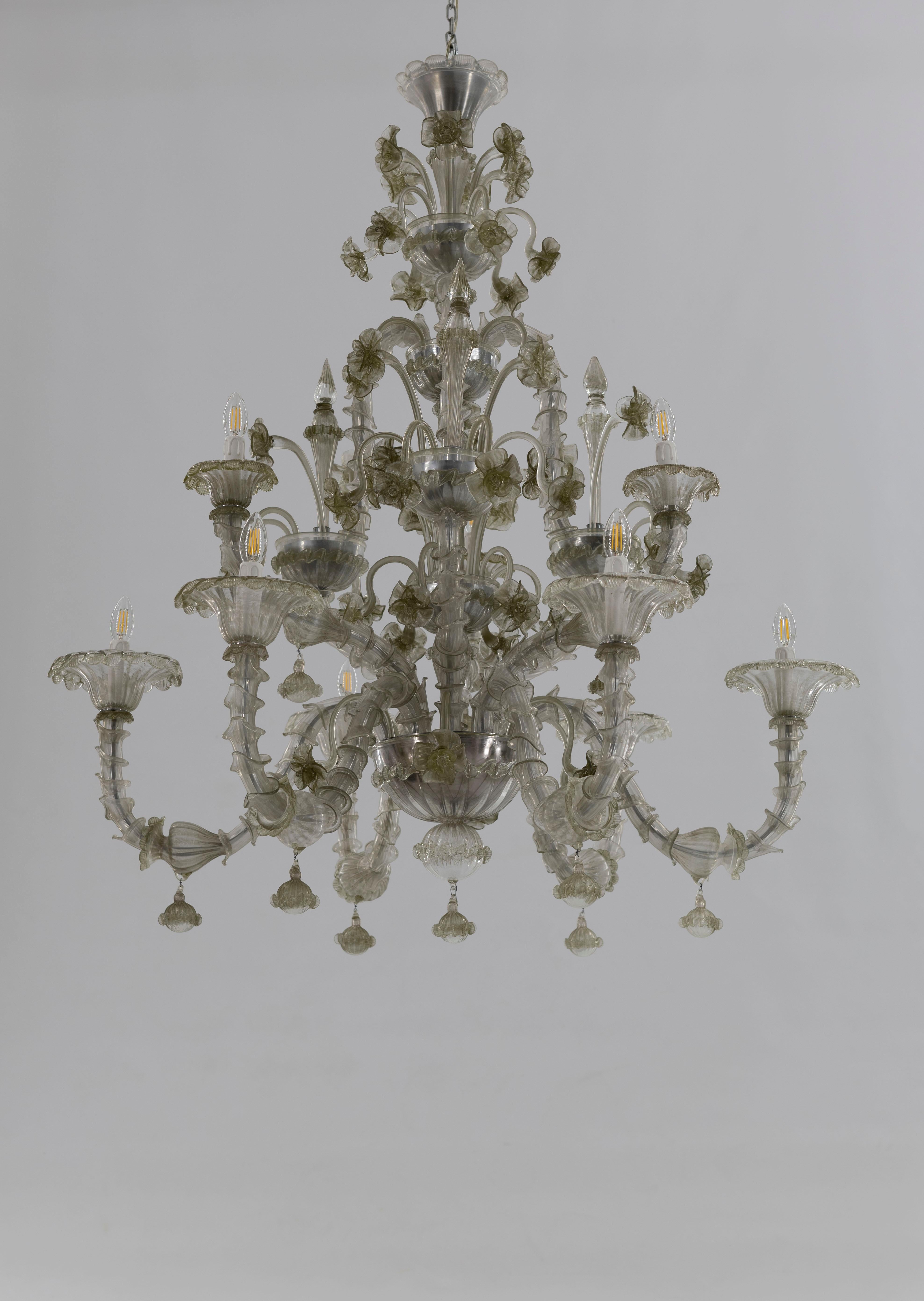  Rezzonico Chandelier in blown Murano Glass green pagliesco contemporary  Italy.
This elegant chandelier is made in color green pagliesco in blown Murano glass, and has a refined conic shape with a total of 9 arms that stretch out to sustain 9 cups