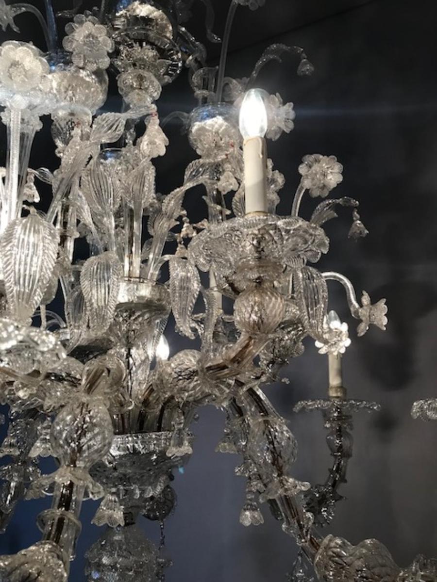 Chandelier handmade according with the old Murano glass tradition, handcrafted in white transparent glass.
The artwork is designed in rezzonico that enriches any interior room with elegance.