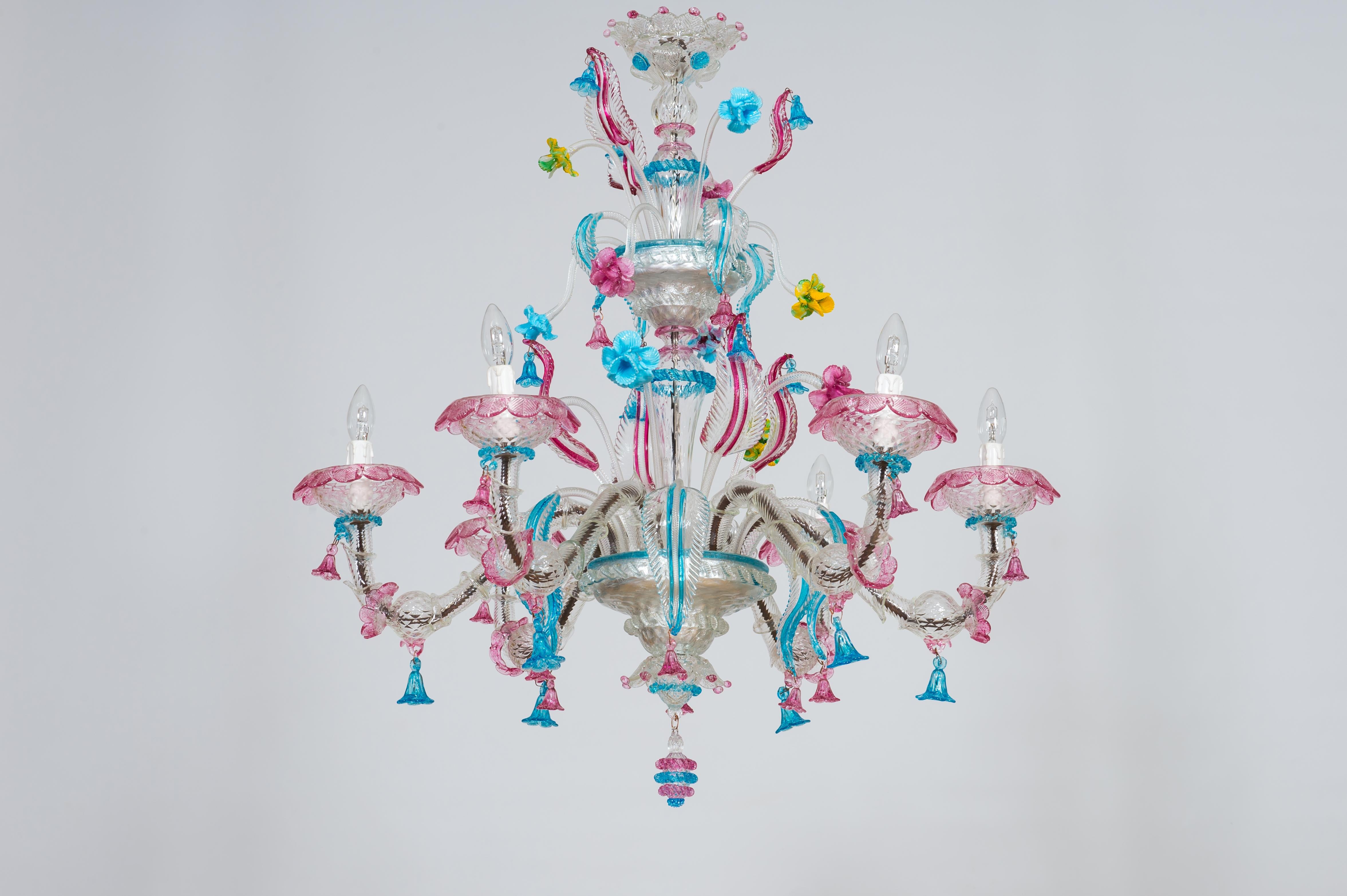Rezzonico floral chandelier made of multicolored murano glass contemporary 2000s.
This beautiful chandelier is a unique piece of the most refined Italian and venetian glass art. It is entirely made of blown murano glass, and it was handmade in the