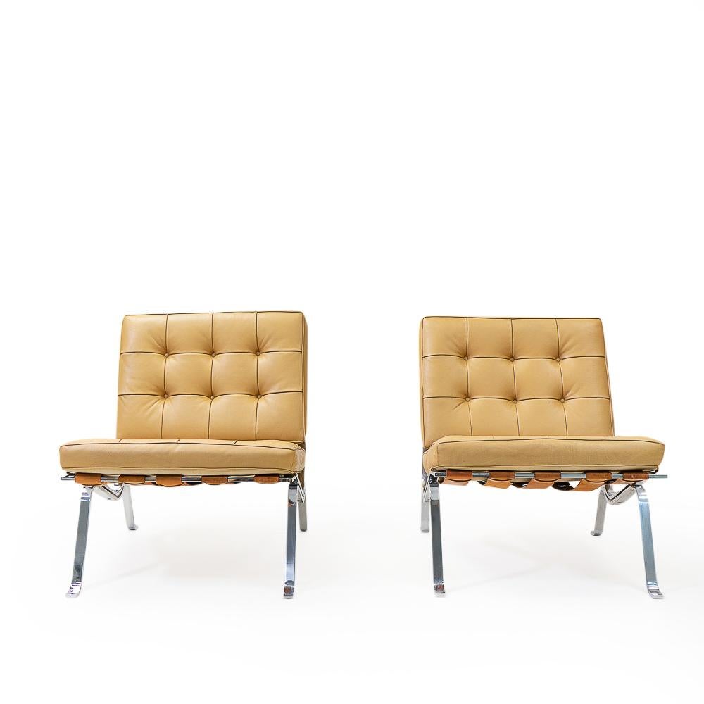 The RH-301 lounge chair was designed by Robert Haussmann as an attribute to the well-known Barcelona chair by Mies van der Rohe, using chromed metal, leather straps and pillows. It eventually became a design classic on its own, receiving the