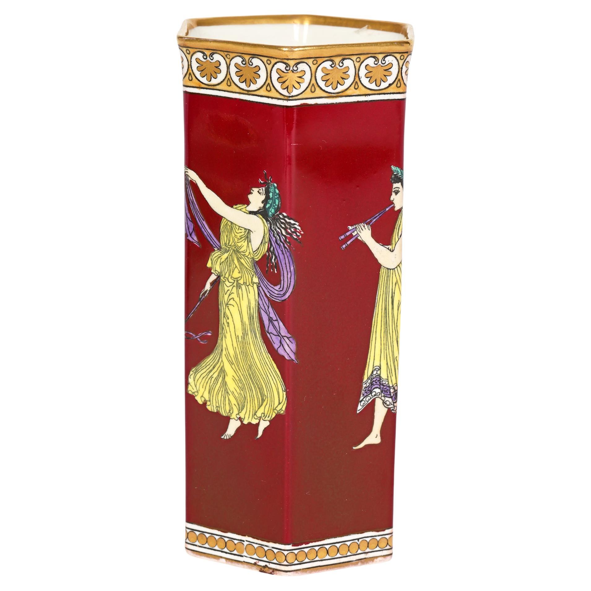 A fine quality Art Deco Tuscan China Grecian Ware porcelain vase decorated with classical figures by RH & SL Plant, Longton, Staffordshire dating from around 1920. The tall hexagonal shaped vase stands on an unglazed foot rim and has a slightly