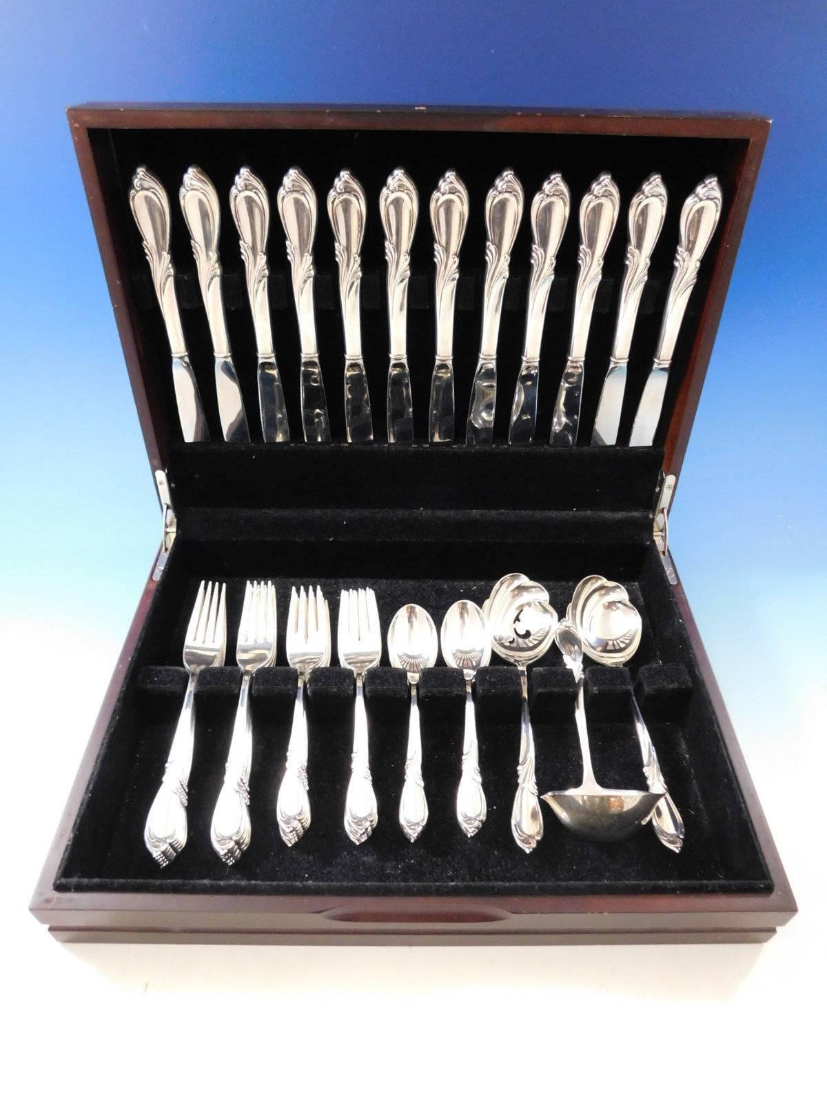 Rhapsody by International sterling silver Flatware set - 51 pieces. This set includes:

Measure: 12 knives, 9 1/4
12 forks, 7 1/4