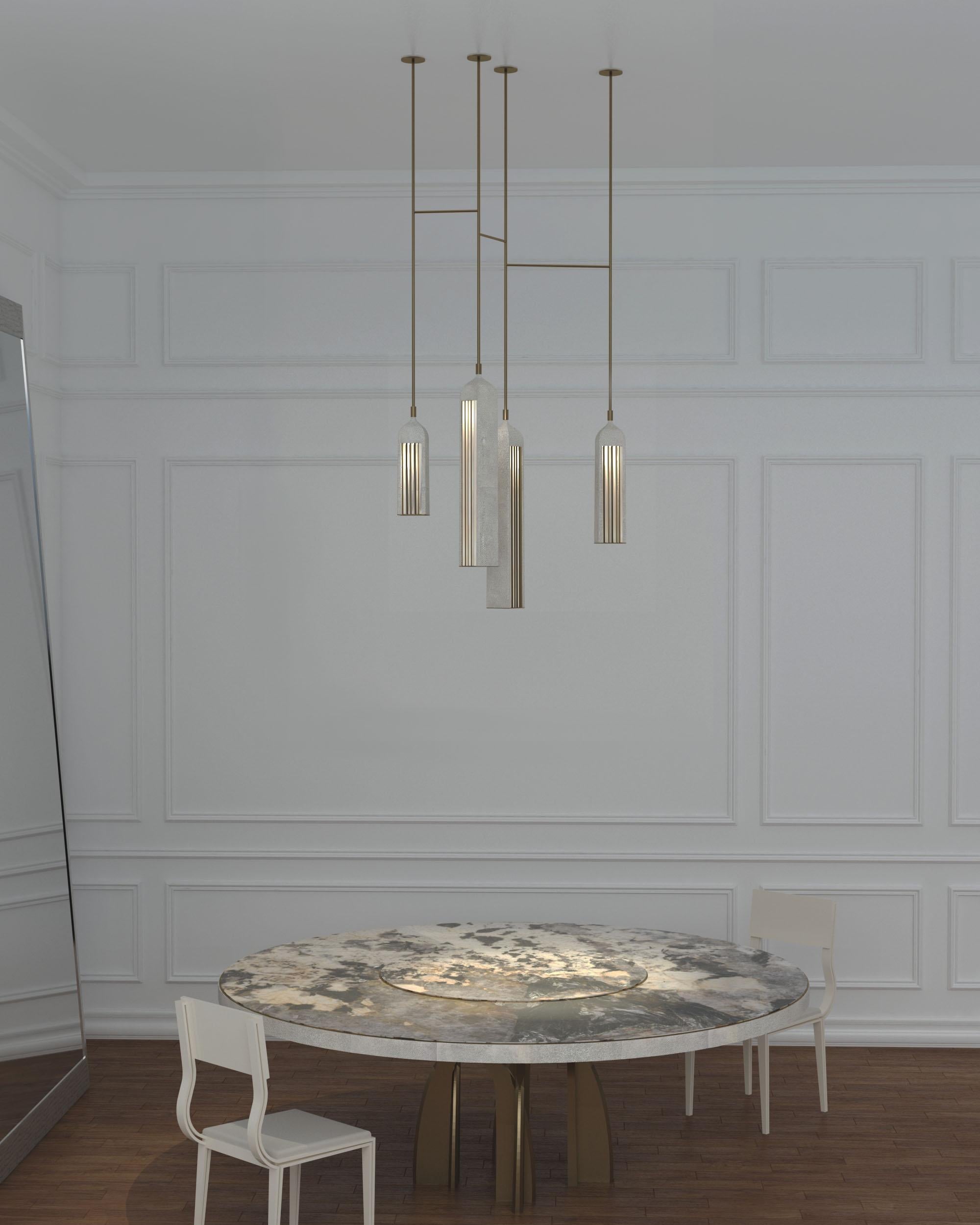 Patrick Coard Paris launches a unique and beautifully sculptural lighting collection inspired by music as a continuation of his candle line. The Rhapsody Cluster I Chandelier is an ethereal and sculptural piece. The metal or quartz slats are