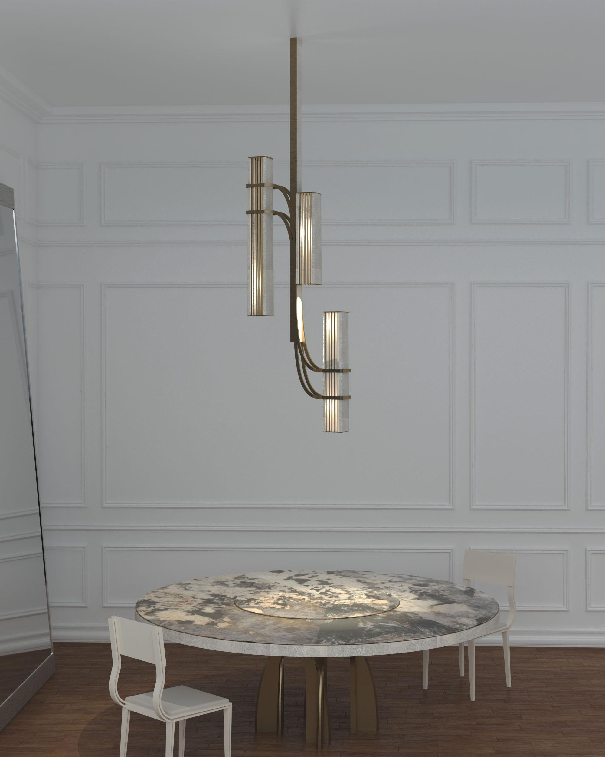 Patrick Coard Paris launches a unique and beautifully sculptural lighting collection inspired by music as a continuation of his candle line. The Rhapsody Cluster II Chandelier is an ethereal and sculptural piece. The metal or quartz slats are