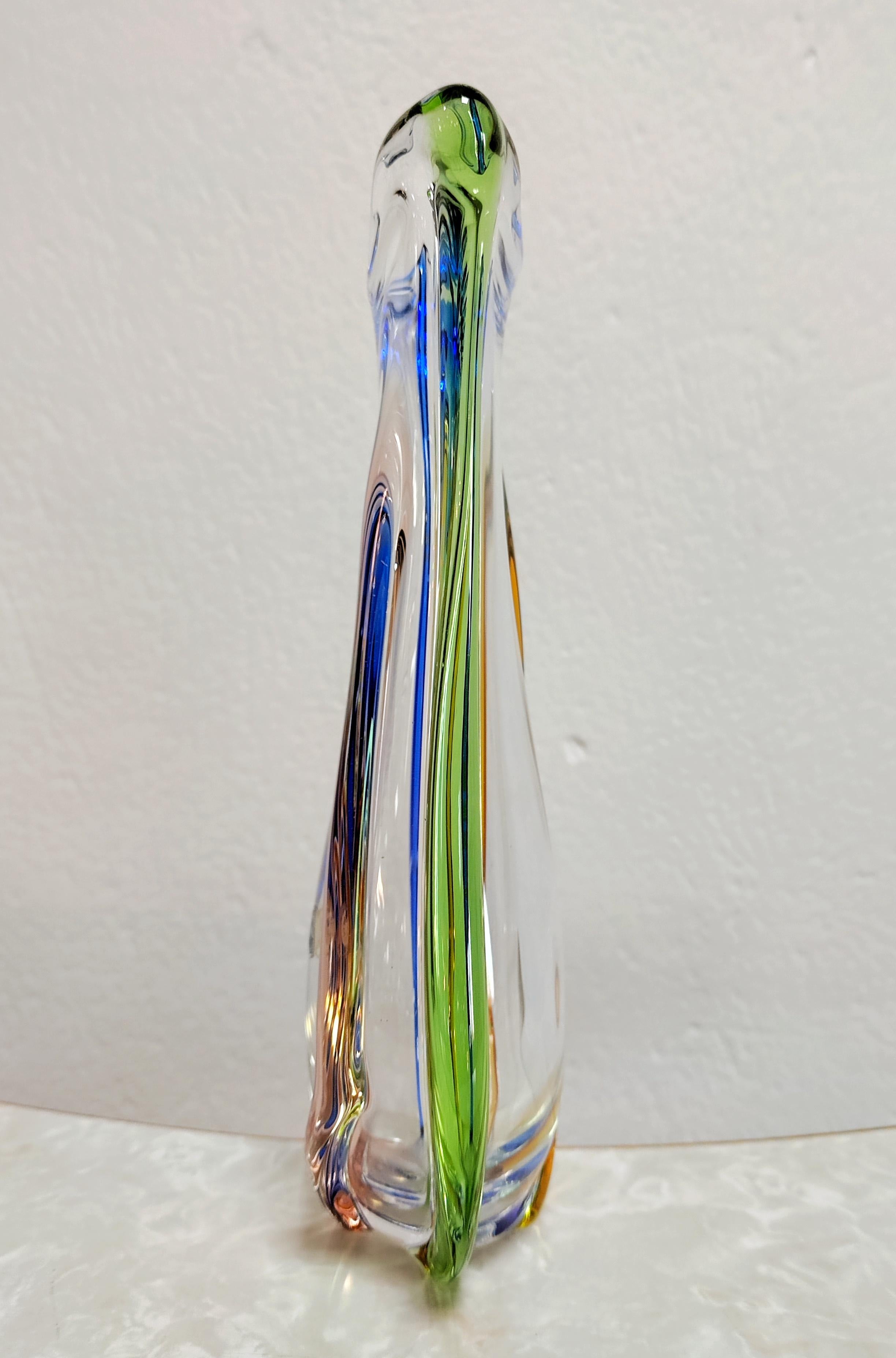 In this listing you will find a rare Mid-Century Modern vase by Frantisek Zemek for SKLO Glass Factory. It features for colorful glass treads going vertically through the vase from top to bottom, in different colors and a very elegant shape, making