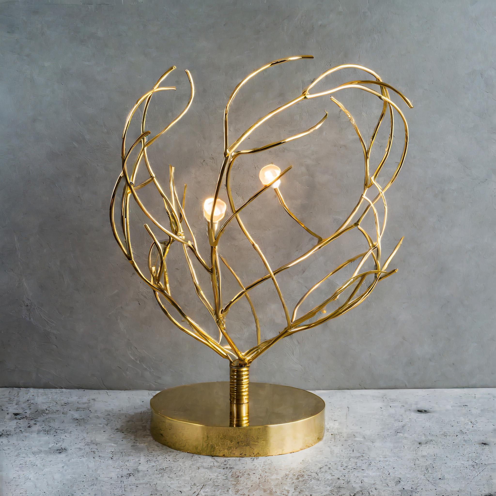 Introducing our exquisite golden brass desk lamp, 'Rhea'– a true poetic masterpiece. Crafted to mimic the organic beauty of branching structures, delicate brass wires intertwine to form tree-like branches, each adorned with 2 to 3 integrated lights