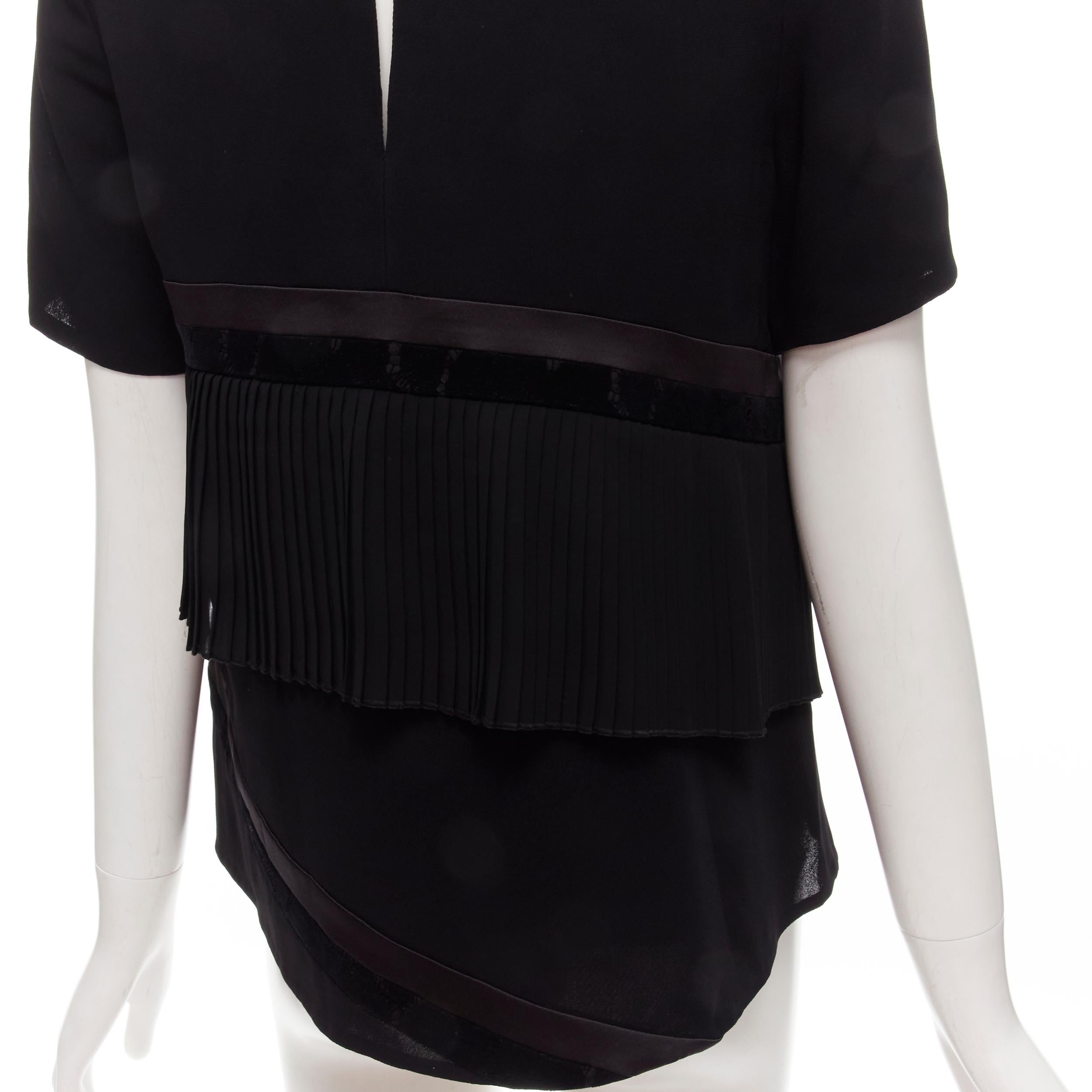 RHIE black satin velvet trim pleated ruffle boxy top US2 S
Brand: Rhie
Extra Detail: Satin and velvet trim. Pleated insert. Keyhole back.

CONDITION:
Condition: Excellent, this item was pre-owned and is in excellent condition. 

SIZING:
Designer
