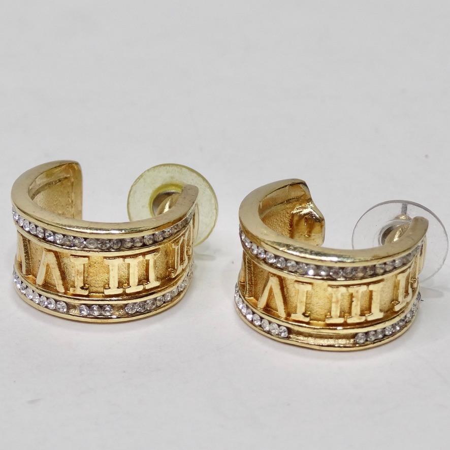 Get your hands on these timeless and elegant rhinestone encrusted gold plated hoops circa 1980s! Classic hoop style earrings feature gold roman numeral engravings surrounded by white rhinestones on the borders. The perfect size for every day wear,