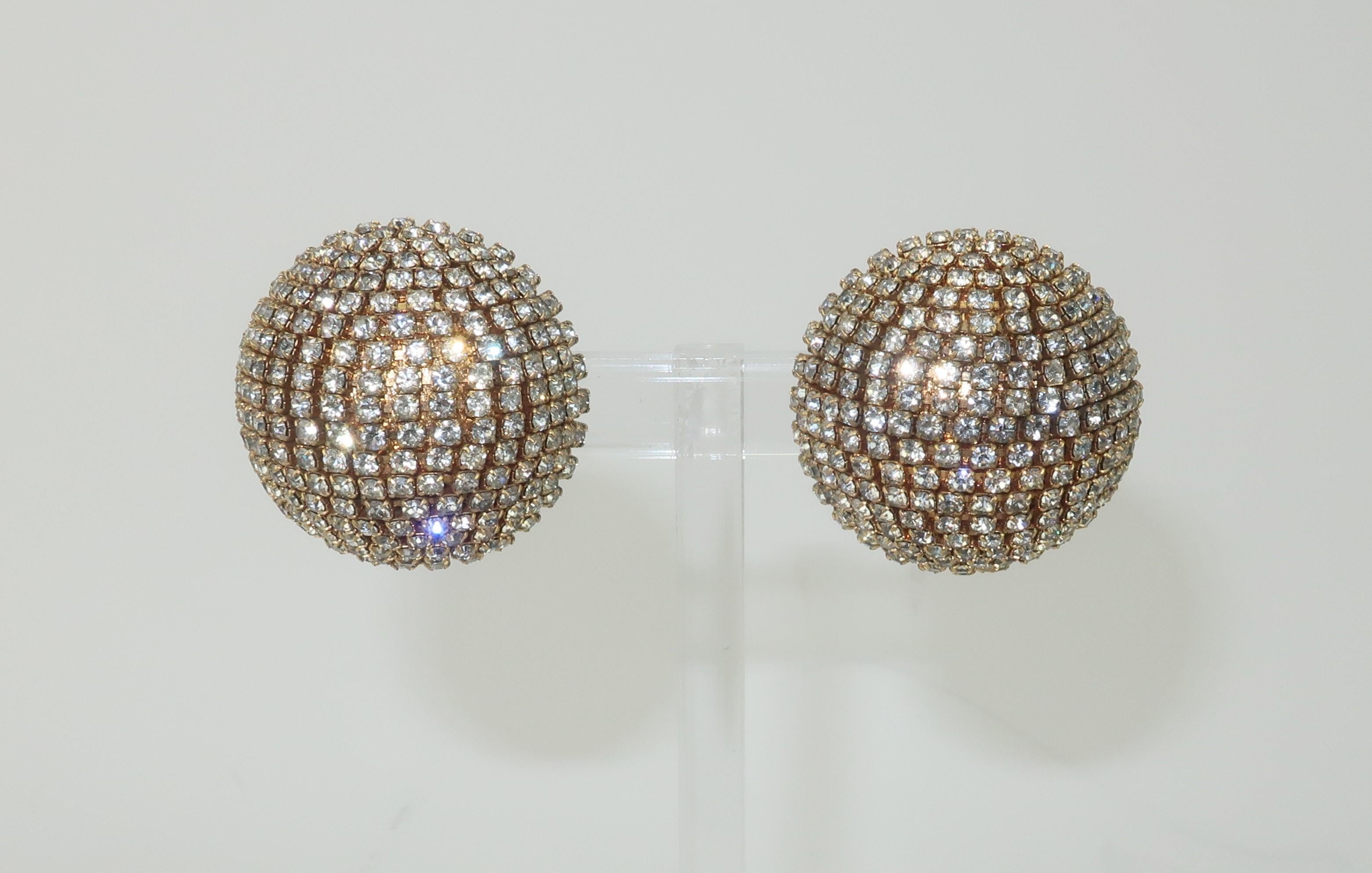 Spectacular sparkles!  C.1980 gold tone metal earrings fully embellished with sparkling crystal rhinestones.  The half dome silhouette is backed by clip on hardware.  A simple design and yet an ultra glamorous look.  Unsigned though well made with