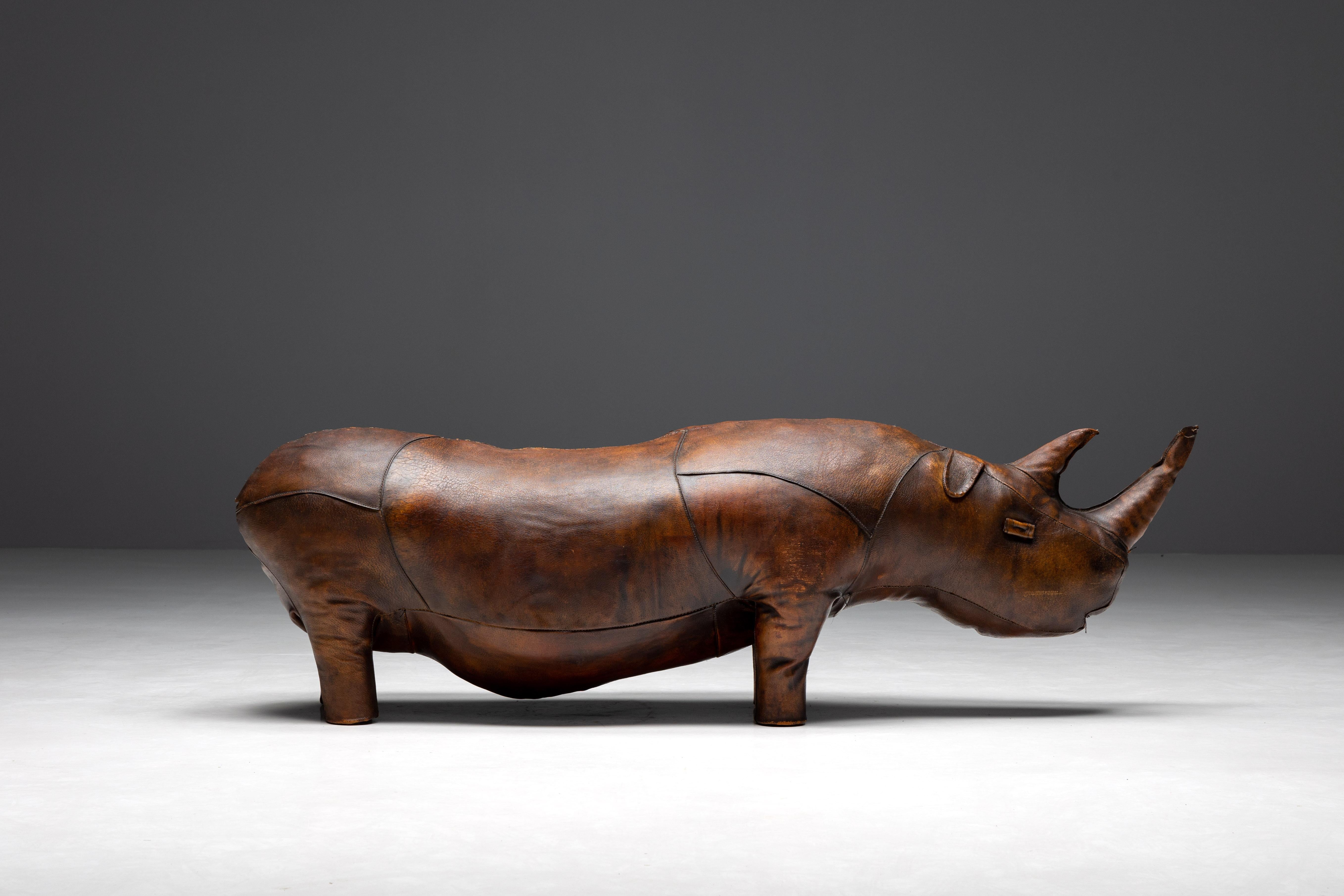 Rhino Footstool by Dimitri Omersa, a vintage gem straight from the 1950s. In solid dark brown leather and good original condition, this rare find adds a dose of mid-century cool to any space. Its quirky rhino shape gives it character, making it a