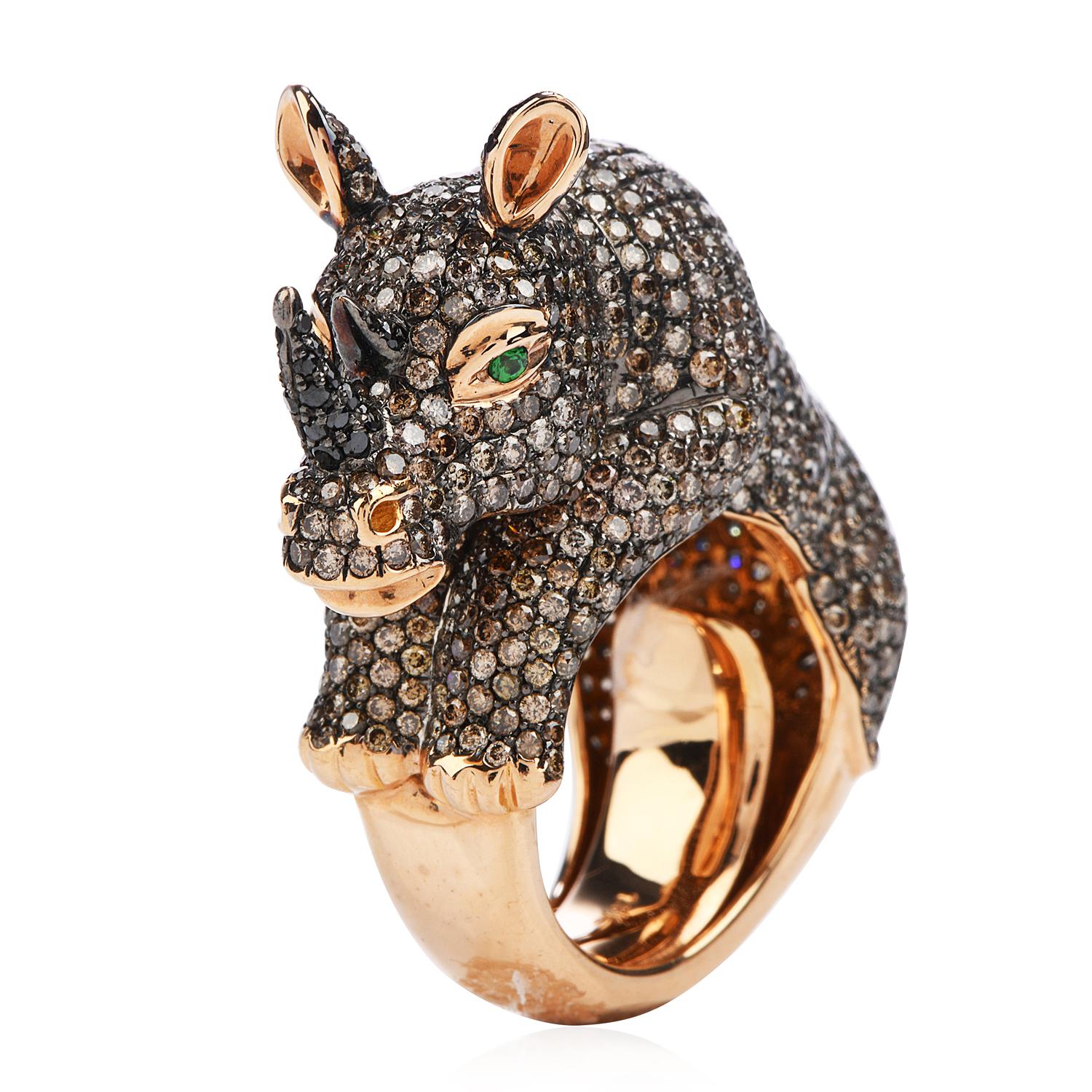 A unique rhinoceros inspired cocktail Diamond ring, the piece missing in any collector's jewelry box.

Crafted in solid heavy 18K rose gold, finely finished with black accents.

The eyes are (2)  round cut, flush set, genuine deep green Tsavorites