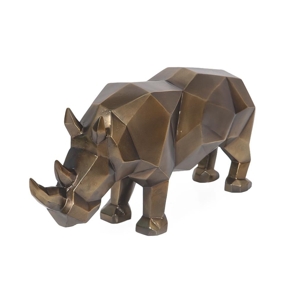 Sculpture en résine de rhinocéros,
en finition bronzage patiné.
Sculpture de style cubique.
Pièce exceptionnelle.