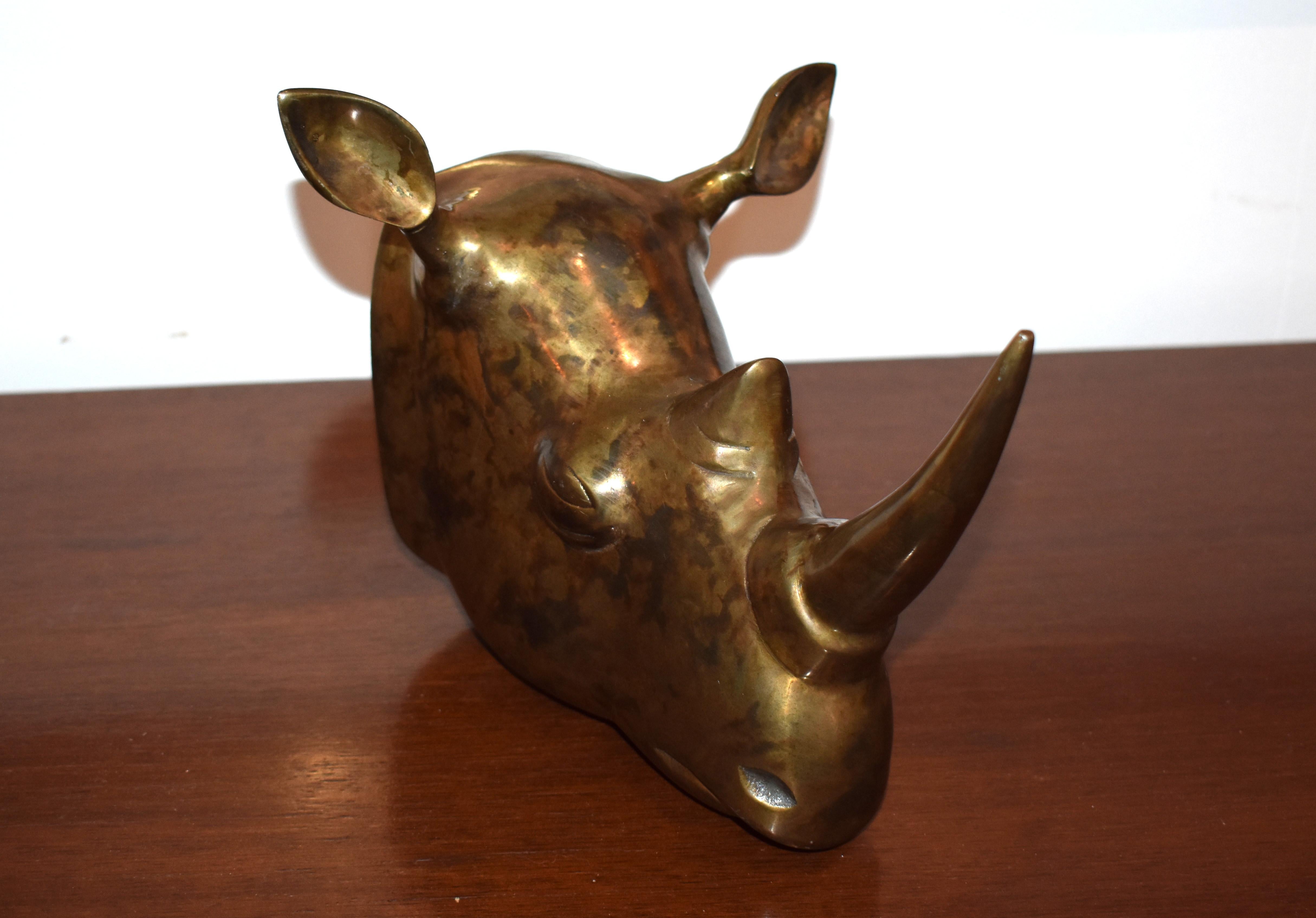 Solid brass rhino head sculpture with a beautiful patina.