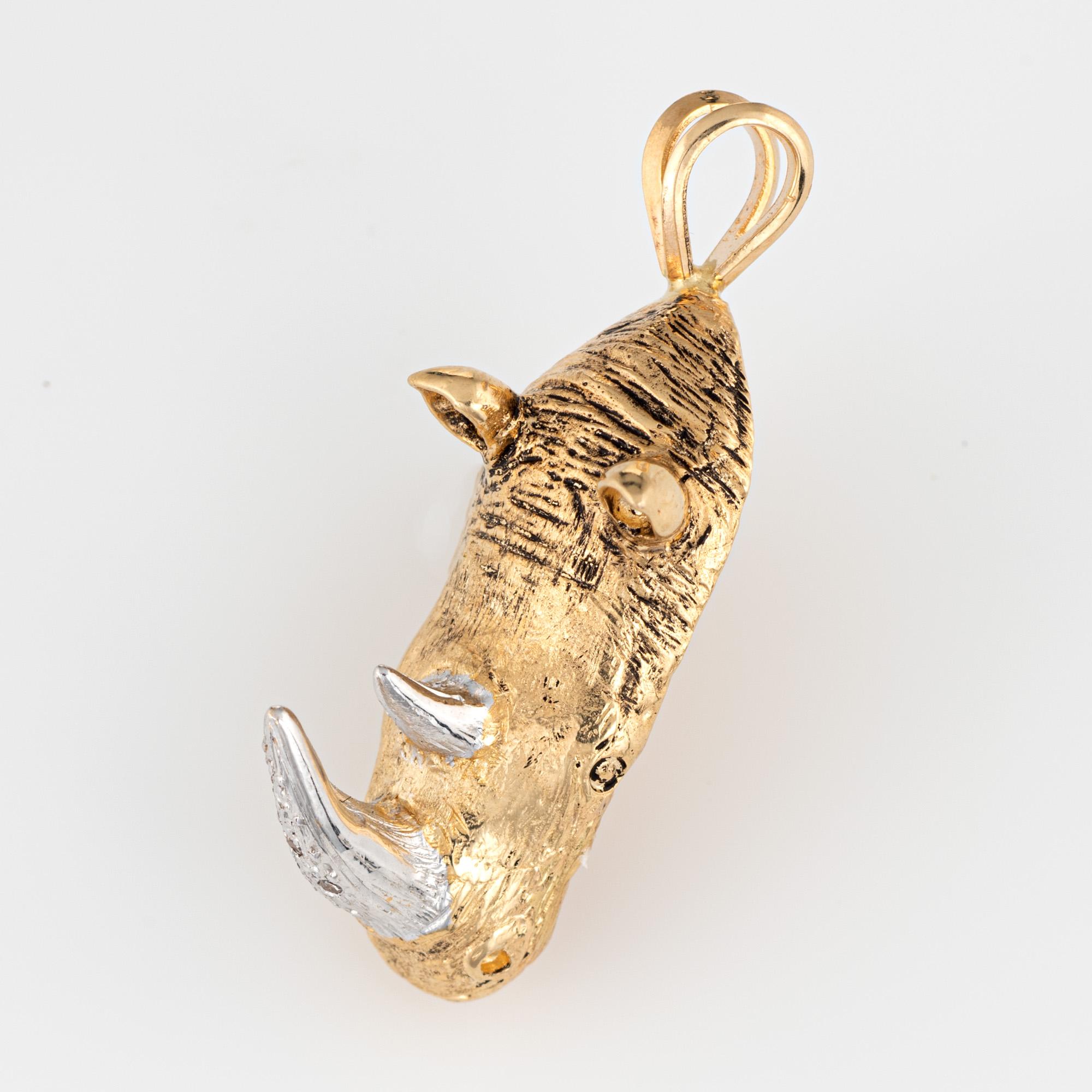 Finely detailed vintage Rhinoceros diamond pendant (circa 1950s to 1960s) crafted in 14k yellow gold.  

Diamonds total an estimated 0.03 carats (estimated at K-L color and I1 clarity). The anchor is set within a ships wheel. Ideal worn as a pendant
