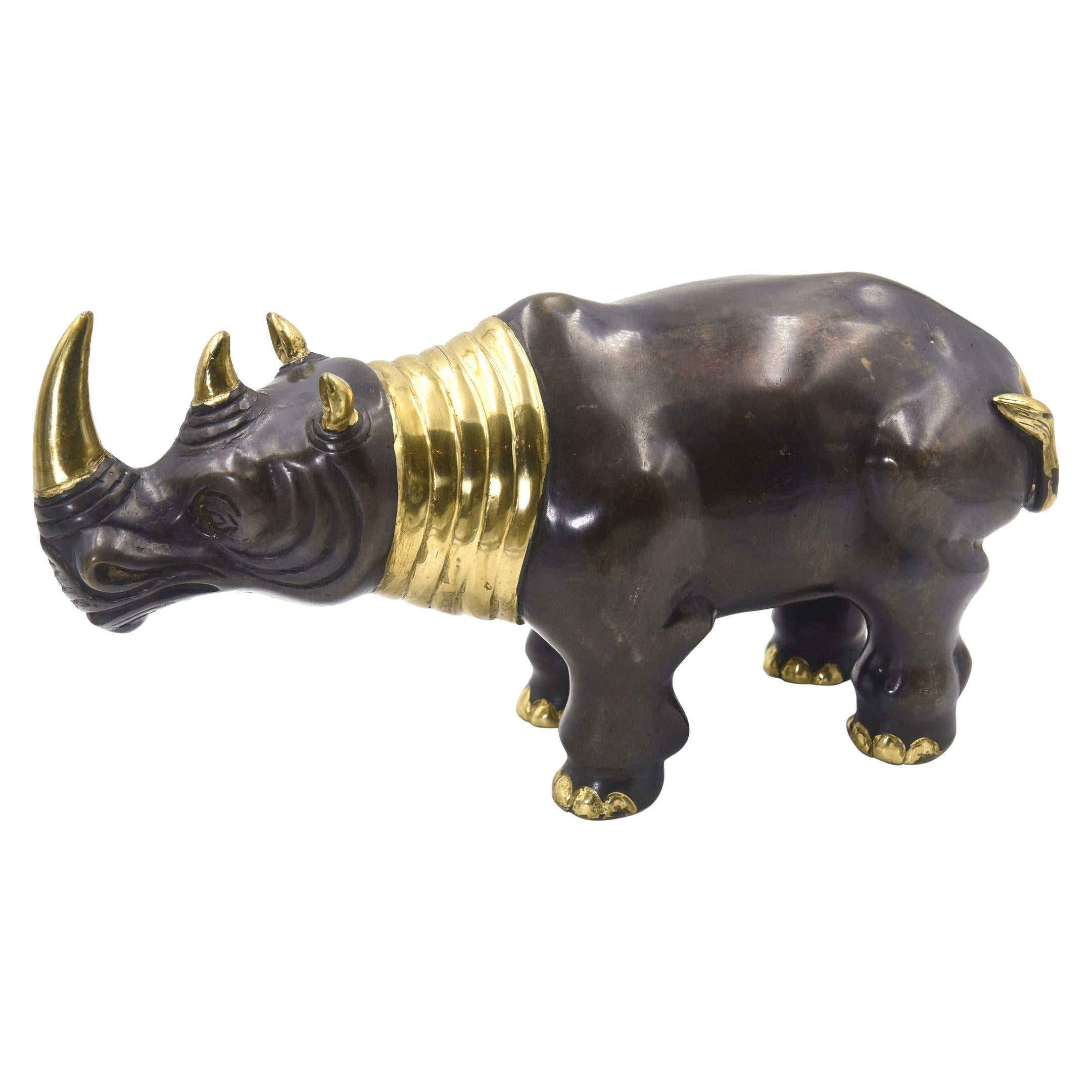 charging rhinoceros statues