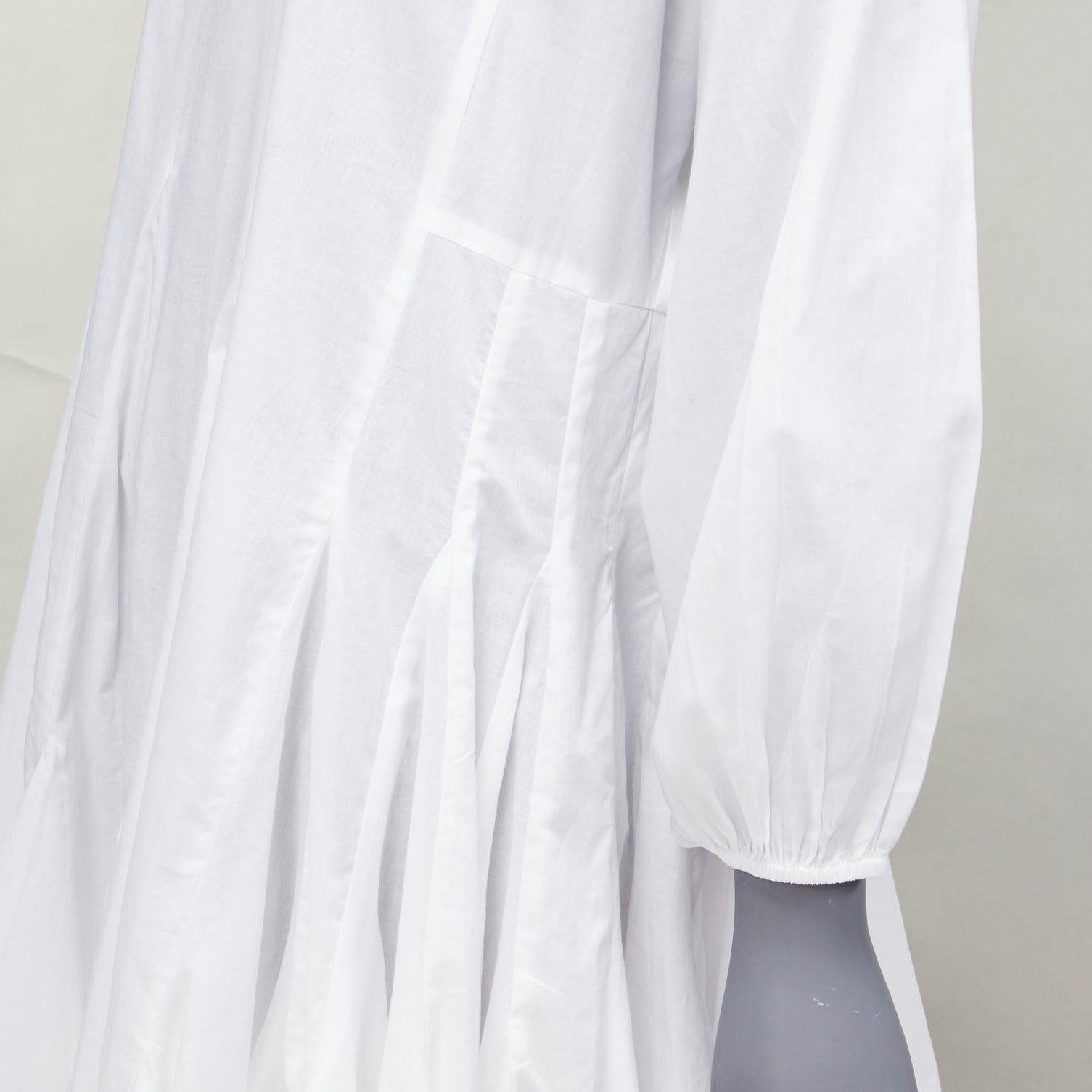 RHODE Ella white cotton long sleeve flutter hem tent dress XS
Reference: AAWC/A01153
Brand: Rhode
Model: Ella
Material: Cotton
Color: White
Pattern: Solid
Closure: Keyhole Button
Lining: White Cotton
Extra Details: Keyhole hook and eye closure.