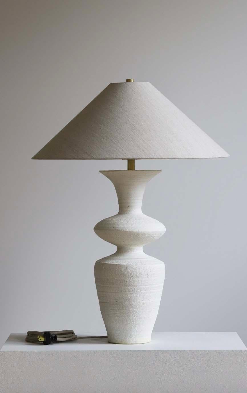 The Rhodes lamp is handmade studio pottery by ceramic artist by Danny Kaplan. Shade included. Please note exact dimensions may vary.

Born in New York City and raised in Aix-en-Provence, France, Danny Kaplan’s passion for ceramics was shaped by