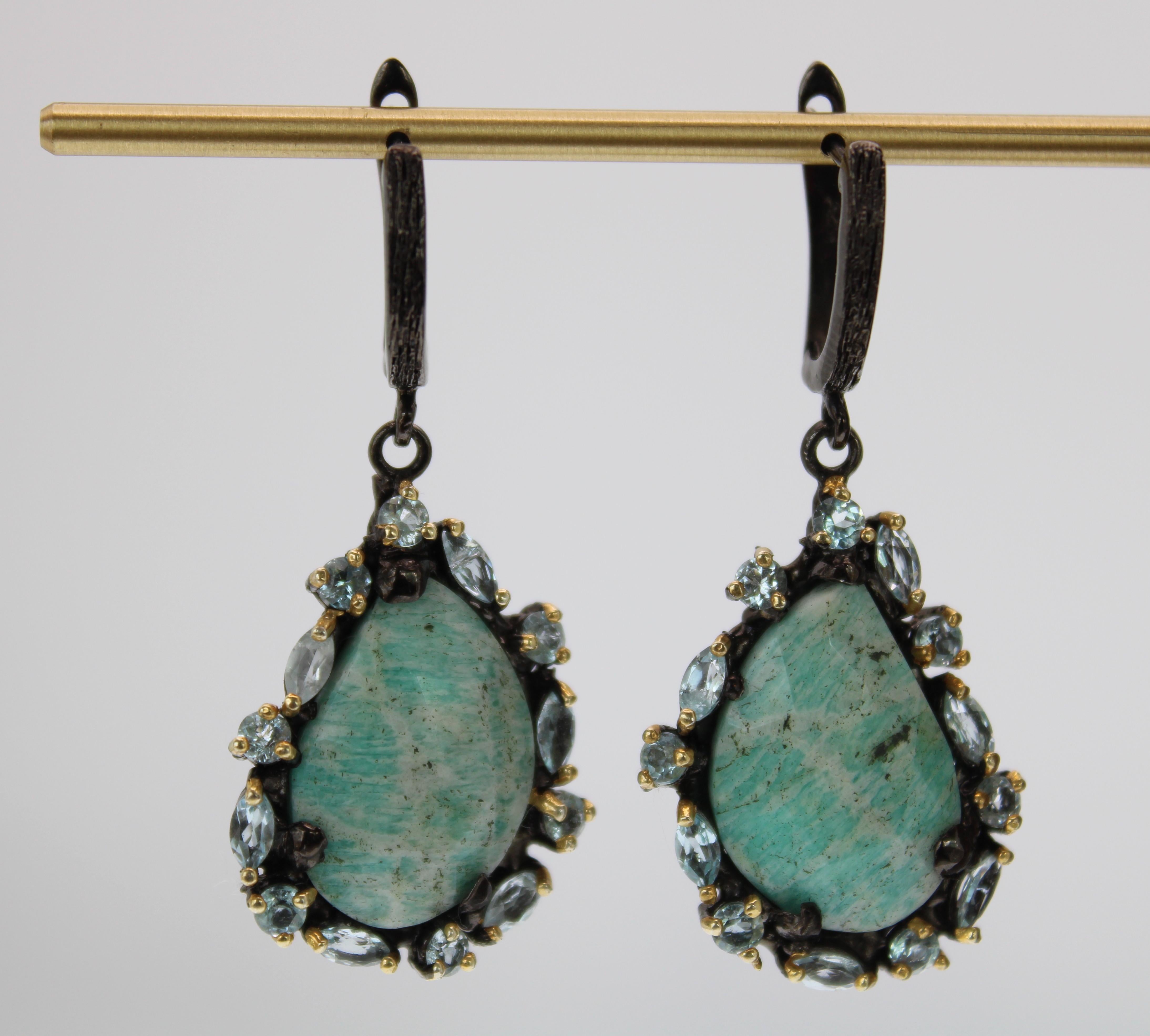 Beautiful pear shaped turquoise natural agate with aquamarine marquise stones and topaz round stones. This earrings are one of a kind and sparkle as the light reflects off the stones with each movement. They are plated in rhodium and 14K gold over