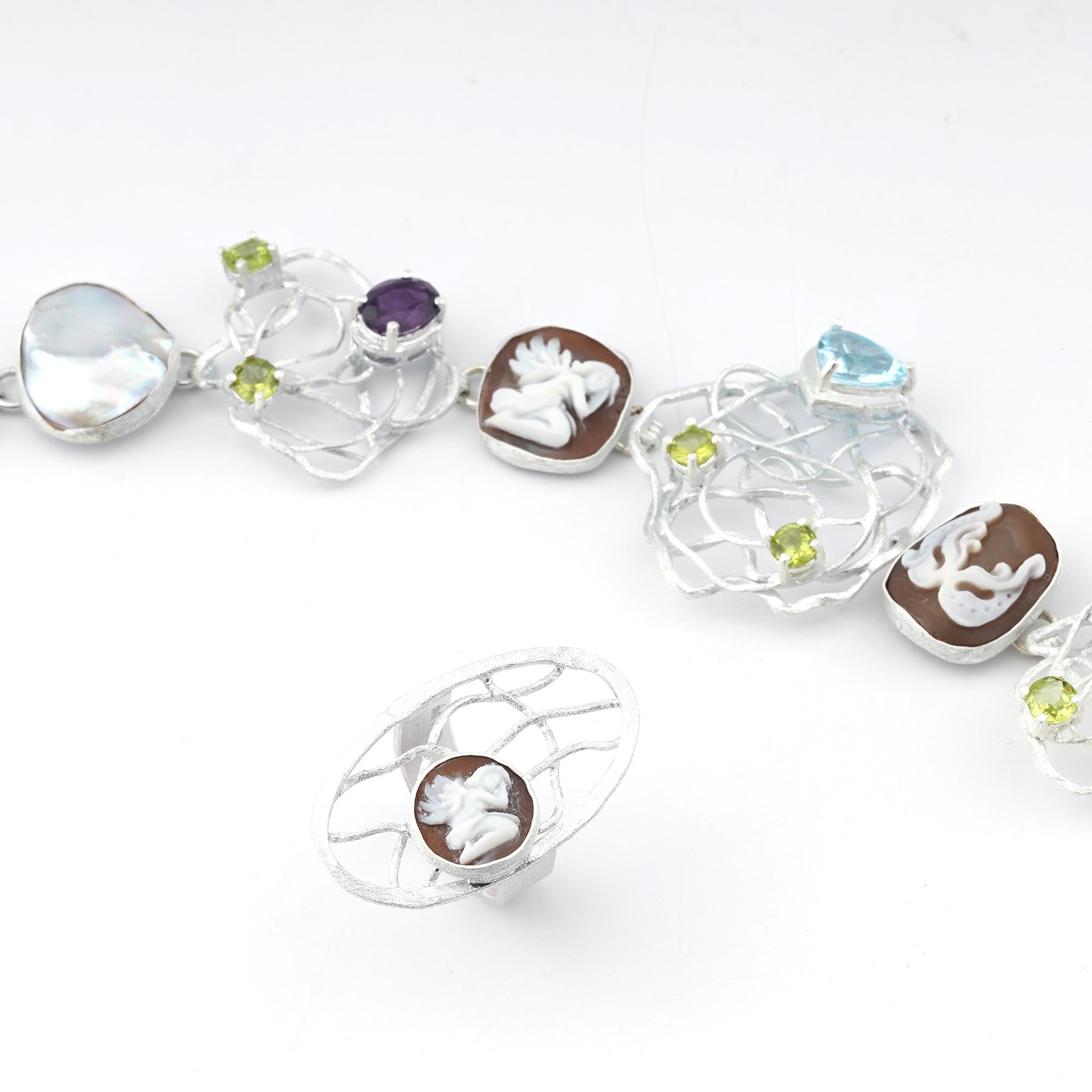 Rhodium Plated 925 Sterling Silver Sea Shell 12/16/18mm cameos Ring Bracelet set. Fully handcarved Angels on sea shell cameos set in a Rhodium plated 925 silver set of Ring and Bracelet with Topaz, peridot, amethyst and cultured pearls on it.