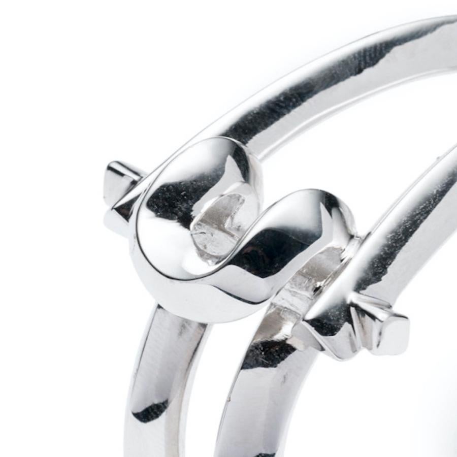 MARCY SMALL CUFF Rhodium-plated brass by THIRD CROWN

Marcy - The MELTING ARC Collection, is the evolution of our signature Arc design and a continuation of our geometric and bold aesthetic. Our classic Arc design has been melted to wrap around your