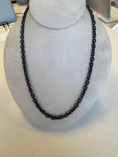 Rhodium plated chain in sterling silver with 20 Karat gold endings & hook