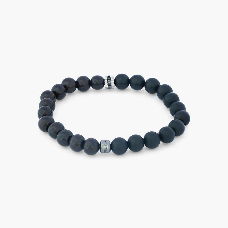 Rhodium Plated Sterling Silver Gear Trio Bracelet with Onyx, Size L

These chunky bracelets, inspired by nature, are perfect for stacking, featuring expertly crafted mini gears that split this style between ebony wood beads and our classic