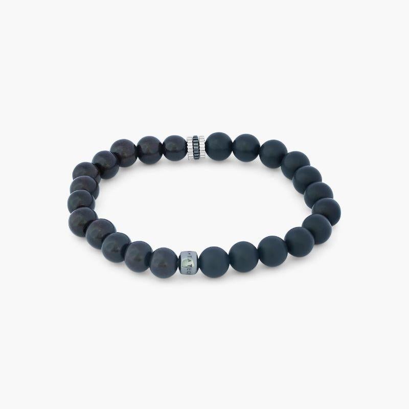 Rhodium Plated Sterling Silver Gear Trio Bracelet with Onyx, Size S

These chunky bracelets, inspired by nature, are perfect for stacking, featuring expertly crafted mini gears that split this style between ebony wood beads and our classic