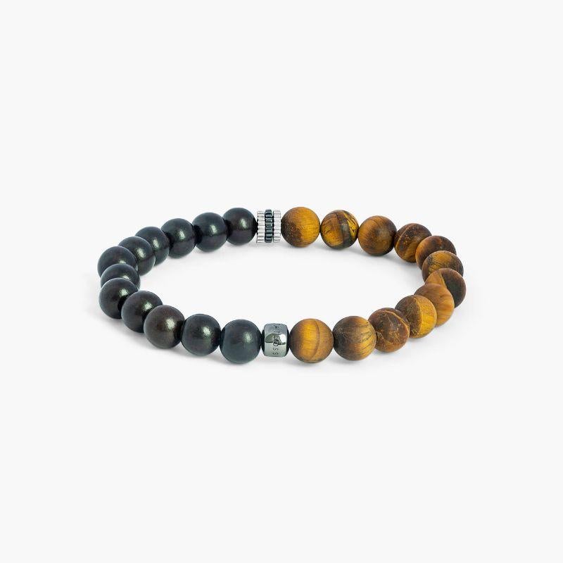 Rhodium Plated Sterling Silver Gear Trio Bracelet with Tiger Eye, Size L

These chunky bracelets, inspired by nature, are perfect for stacking, featuring expertly crafted mini gears that split this style between ebony wood beads and our classic
